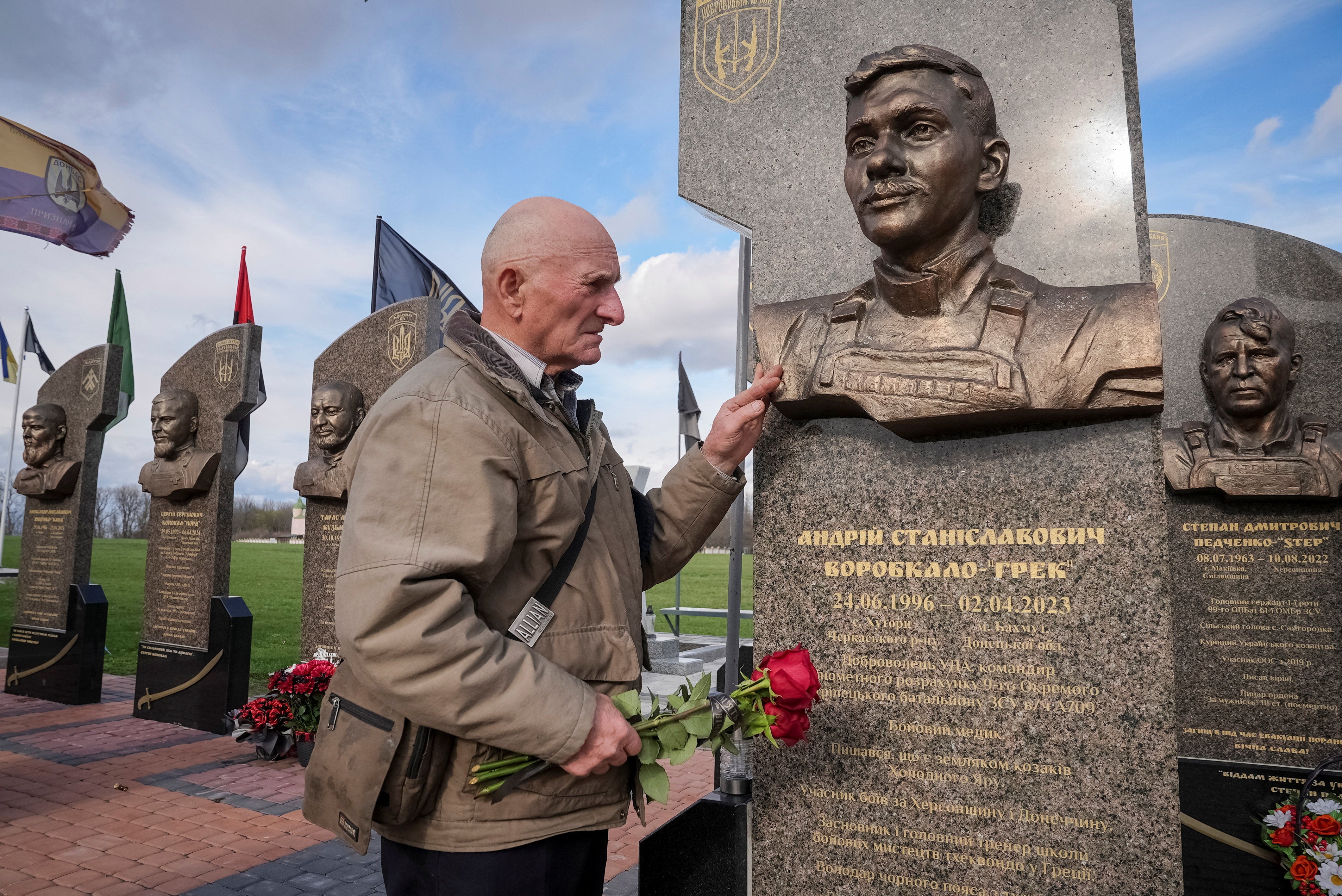 Petro Hurin visits the monuments dedicated to his grandson Andrii, a Ukrainian serviceman in Cherkasy region