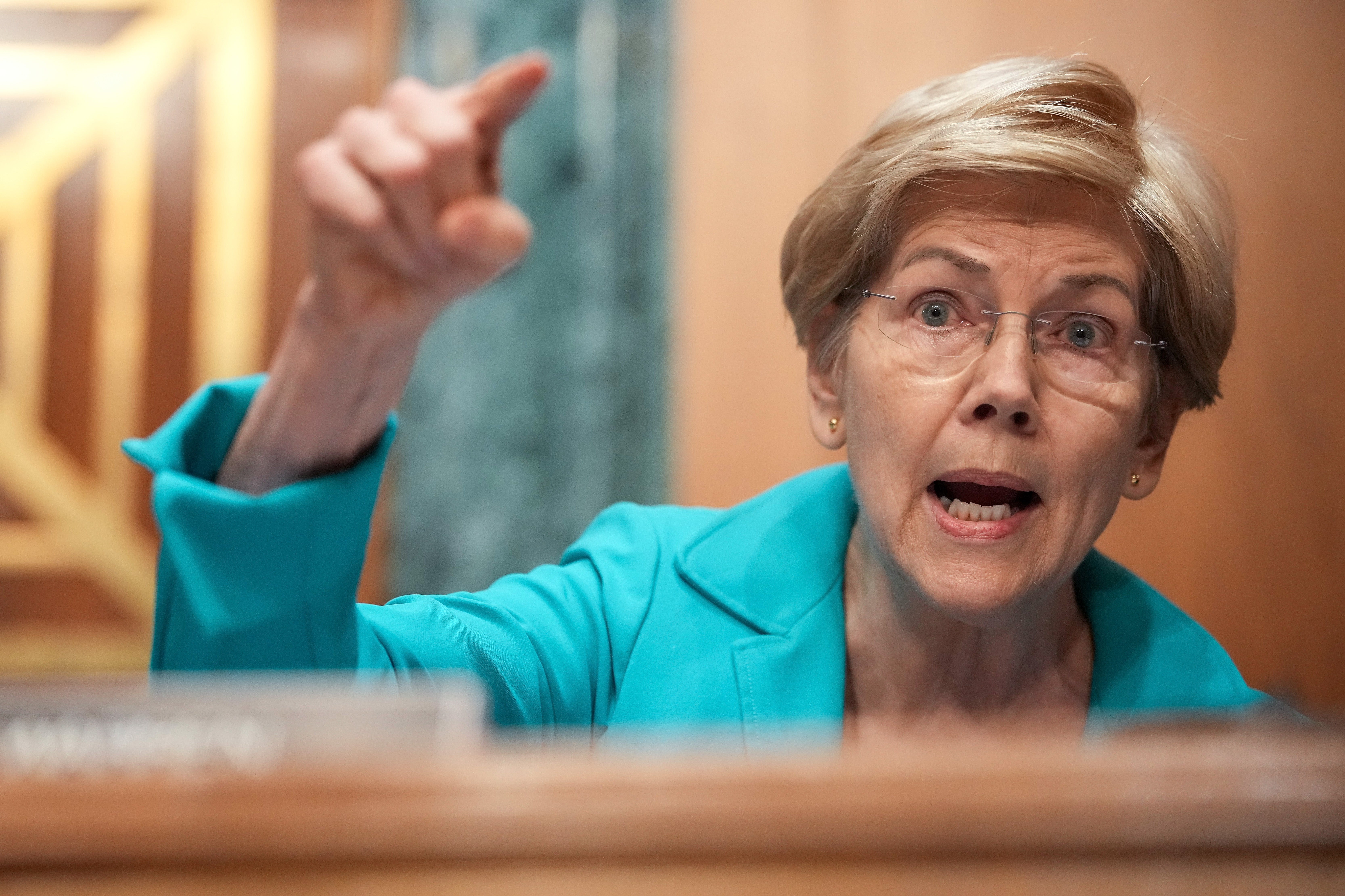 Senate Banking Committee’s top Democrat Elizabeth Warren grilled Warsh on his assets and loyalty to Trump