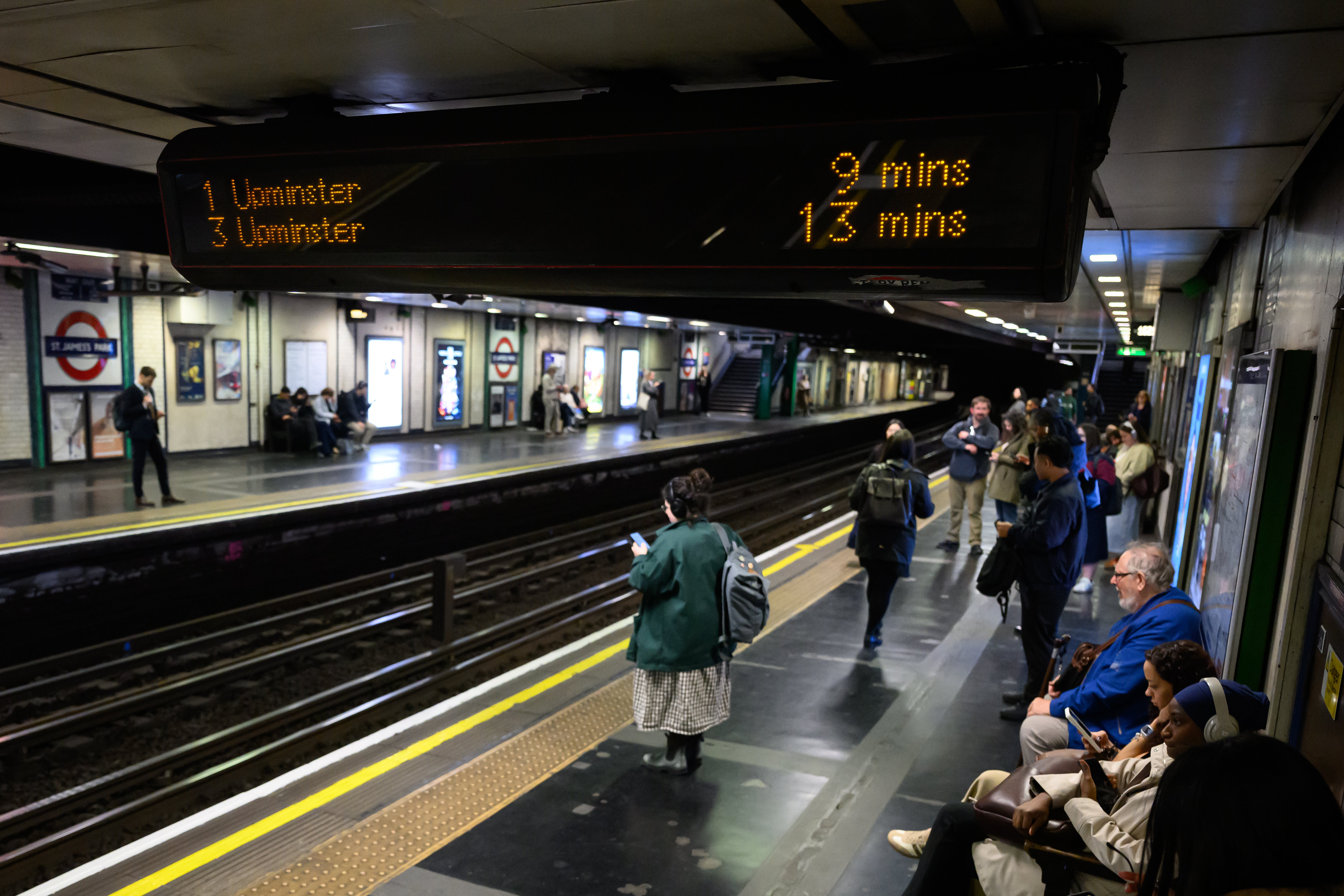 Electronic signage warns of lengthy waits in between trains as a strike by the RMT union begins