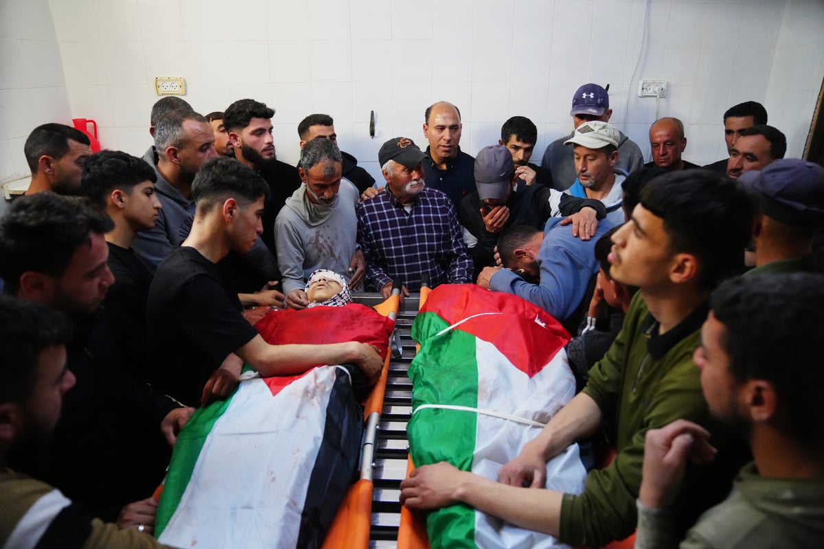 Israeli army reservist kills 2 Palestinians, including a 14-year-old, in the occupied West Bank