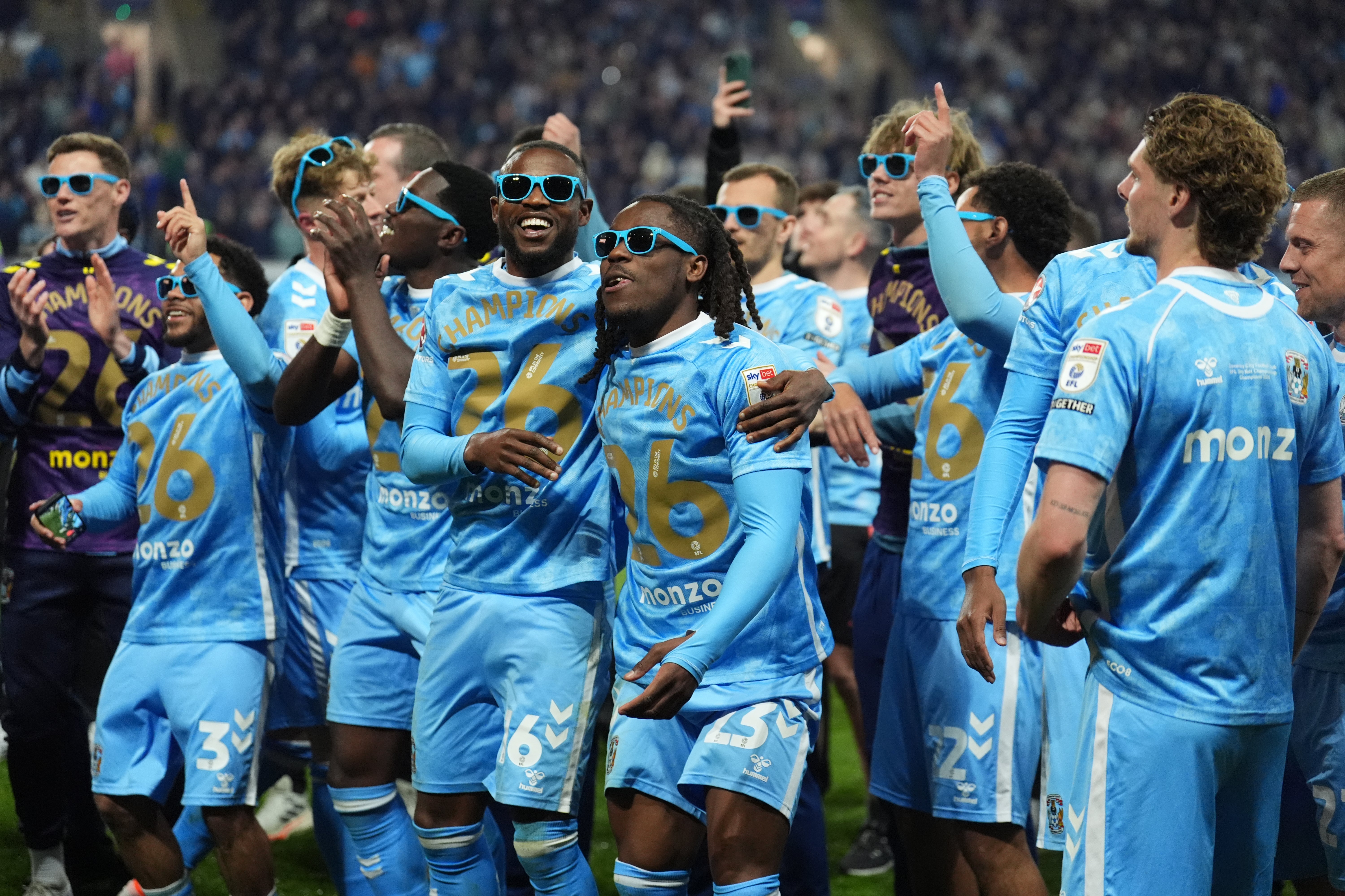 The Coventry players celebrate after securing the title