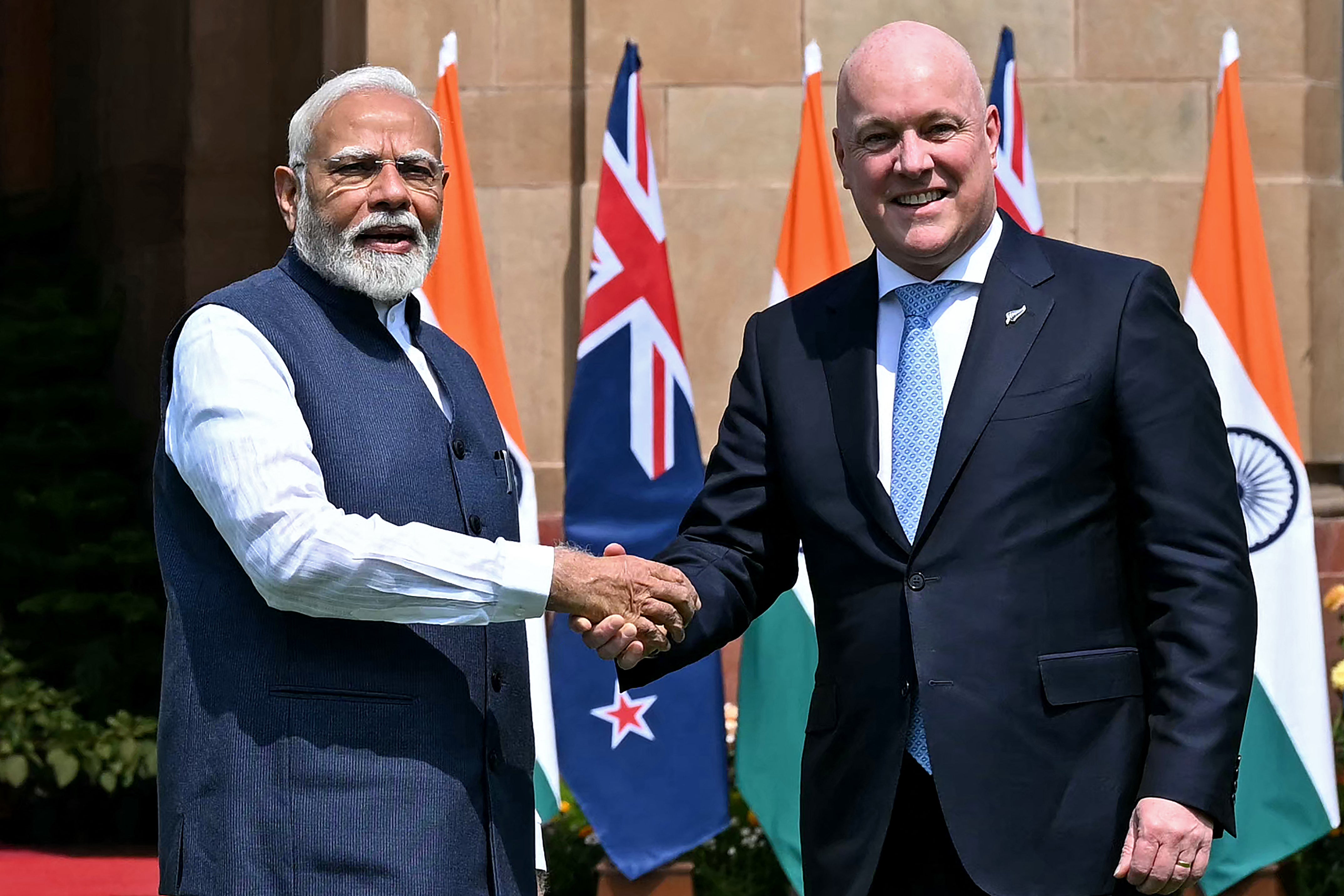 India's prime minister Narendra Modi shakes hands with his New Zealand's counterpart Christopher Luxon before their meeting at the Hyderabad House in New Delhi