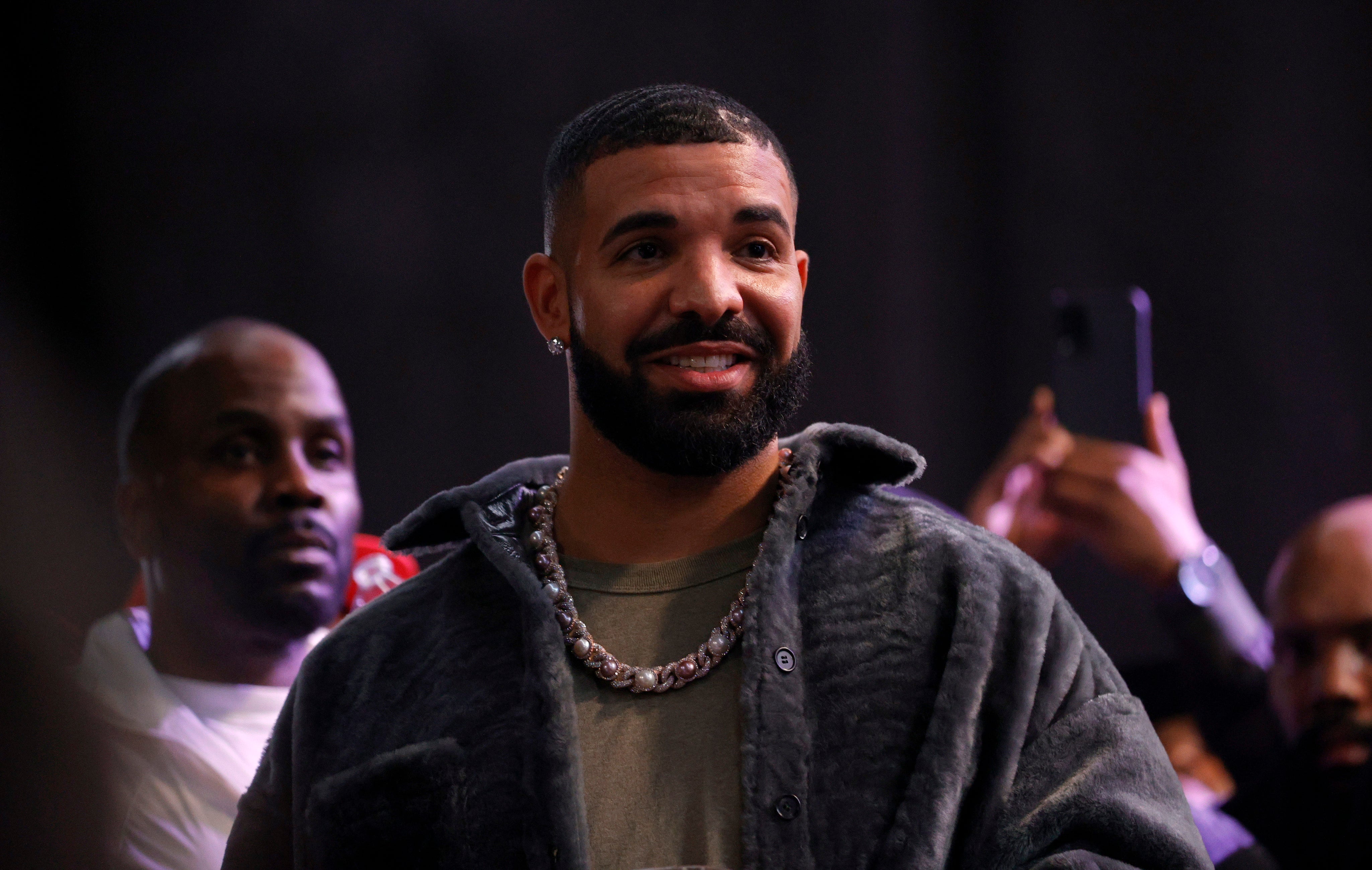 Drake fans use pickaxes to break into ice block containing album release date