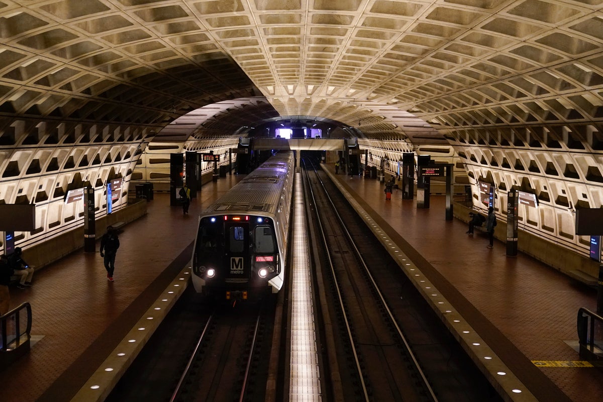 A work vehicle hits a stopped Washington Metro train, injuring 11