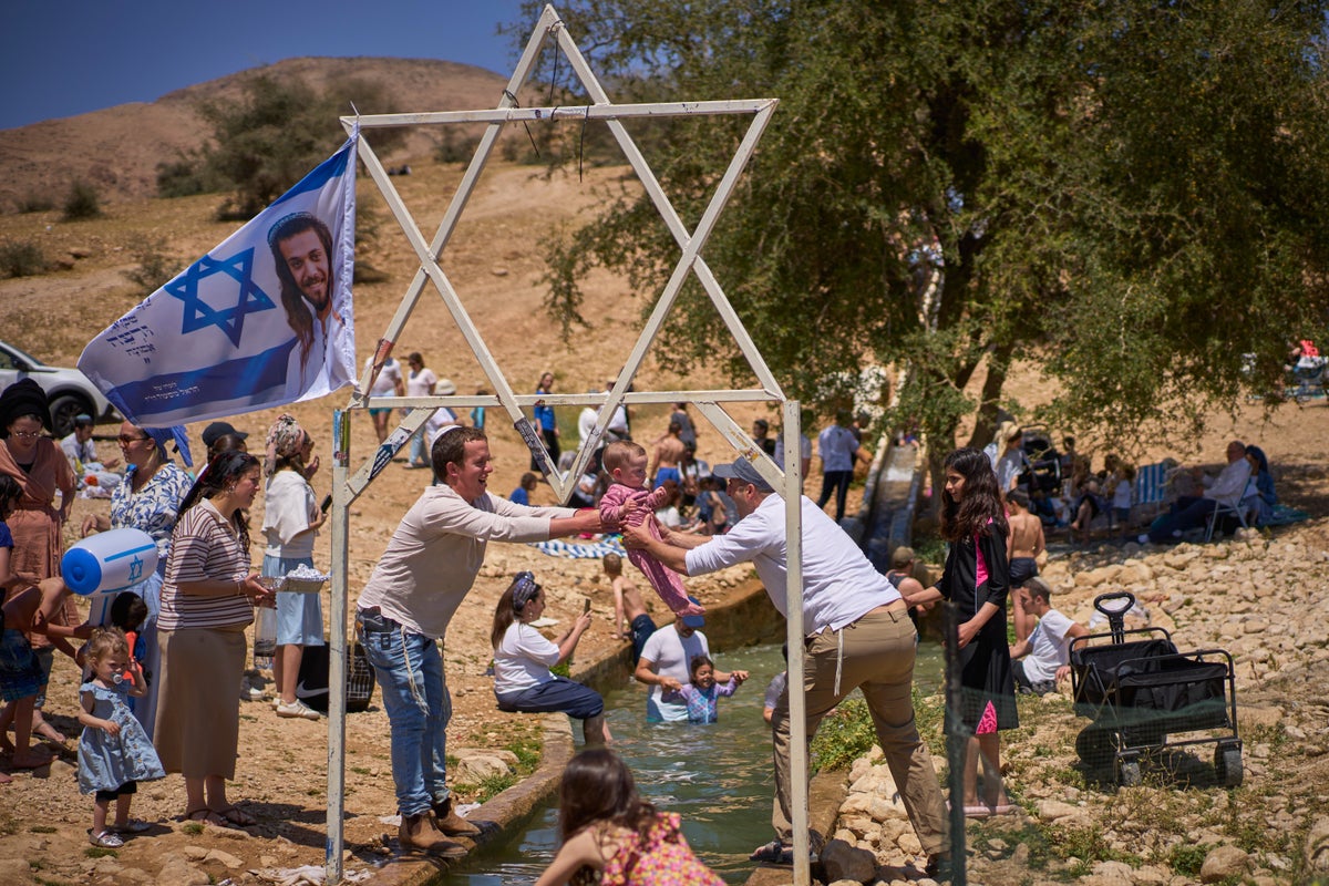Photos show Israelis celebrating at a West Bank spring despite heightened tensions