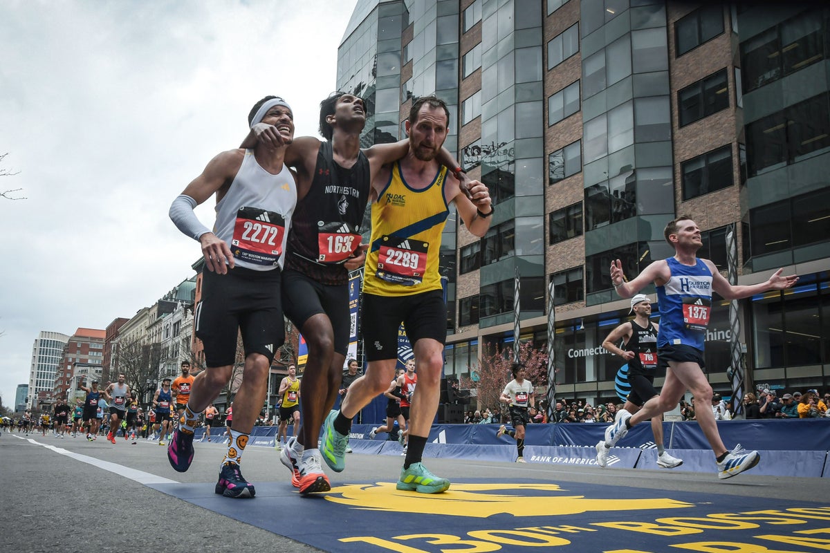 Runners were struggling to finish Boston Marathon when competitors came along and helped them across
