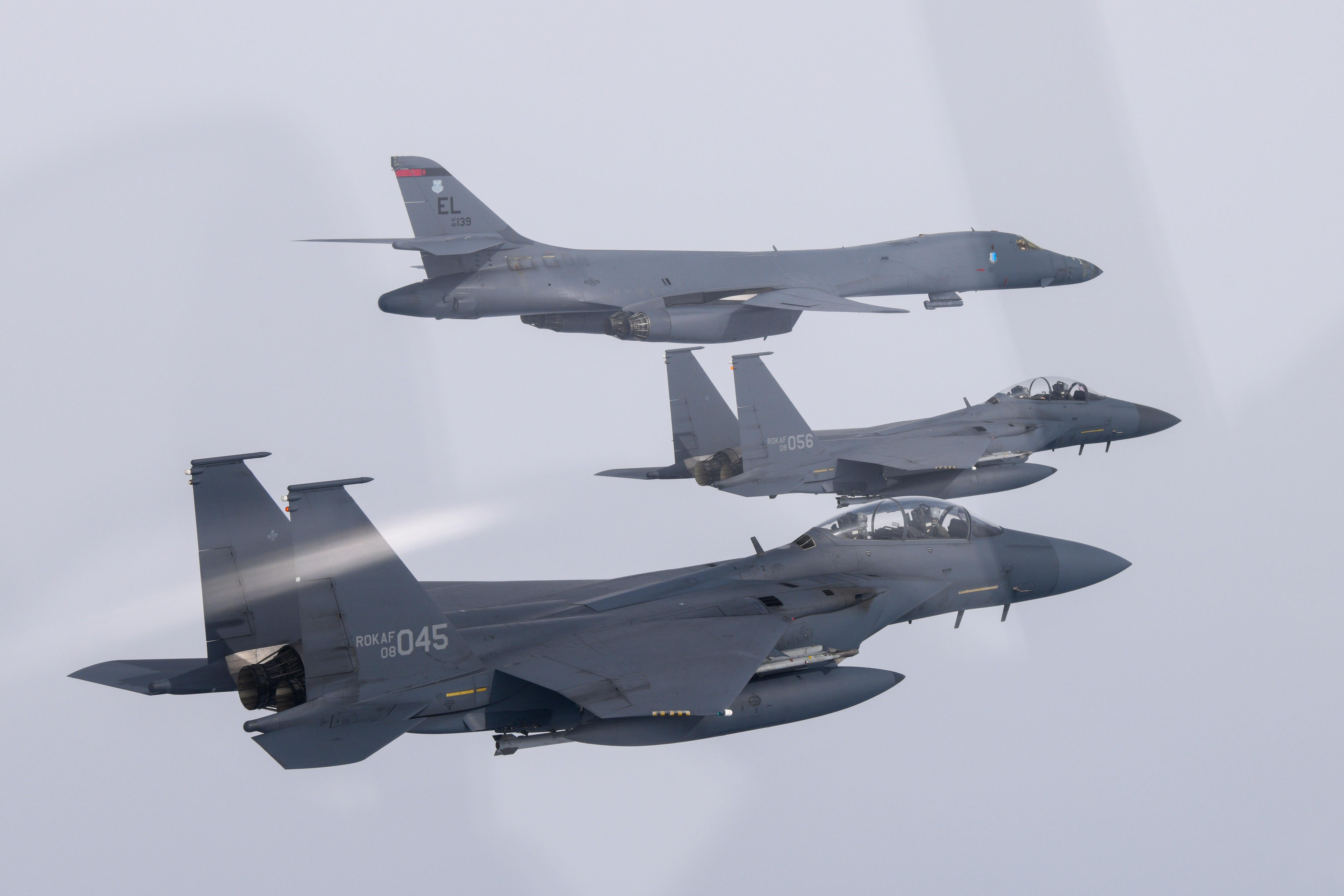 A US Air Force B-1B bomber, and South Korean Air Force F-15K fighter jets fly over South Korea Peninsula during a joint air drill on March 03, 2023 at an undisclosed location in South Korea