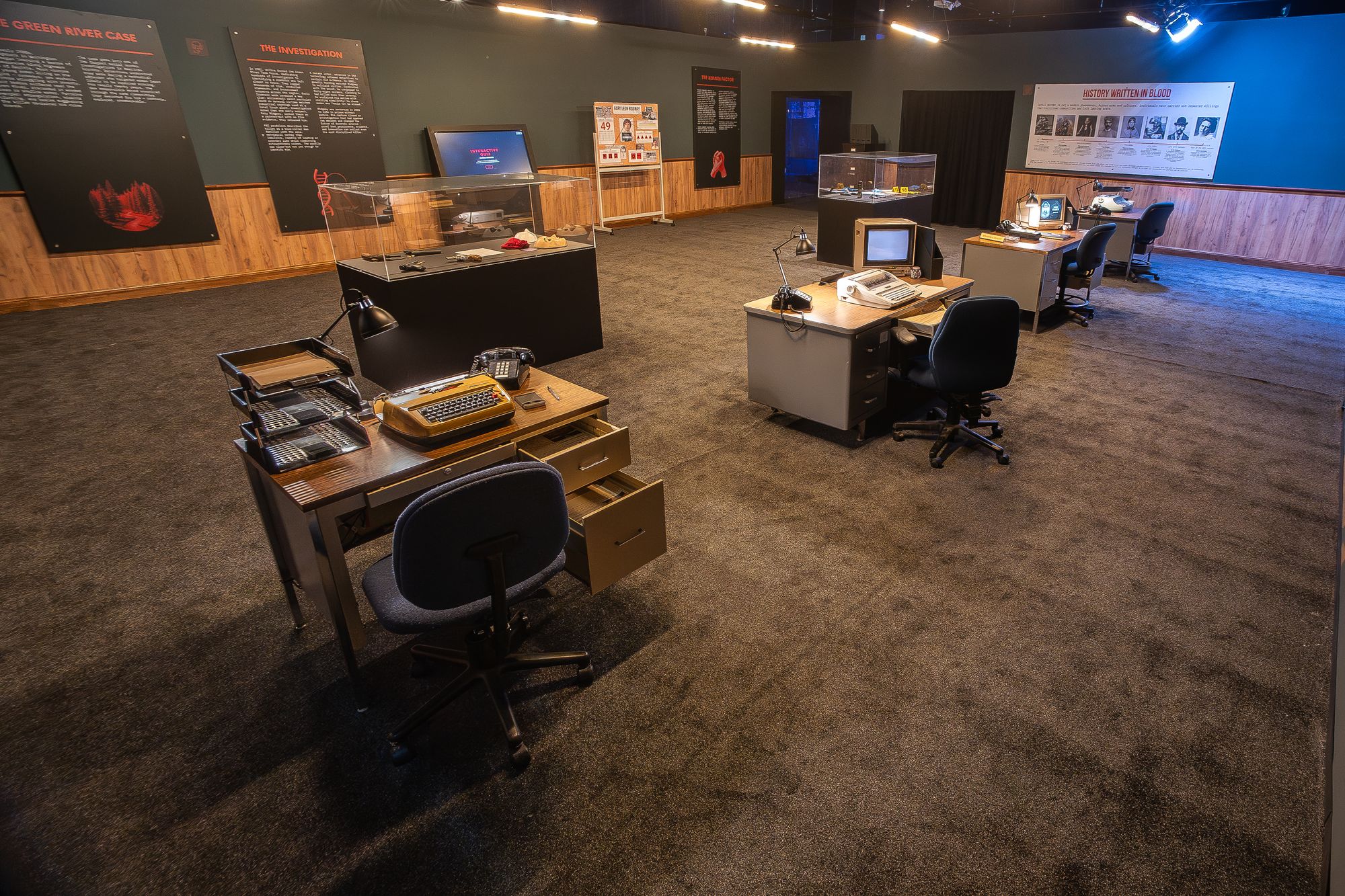 The experience begins in a brightly-lit mock investigation room, where visitors tap away on vintage typewriters, snap mugshots and attempt to solve crimes through criminal profiling and behavioral analysis techniques
