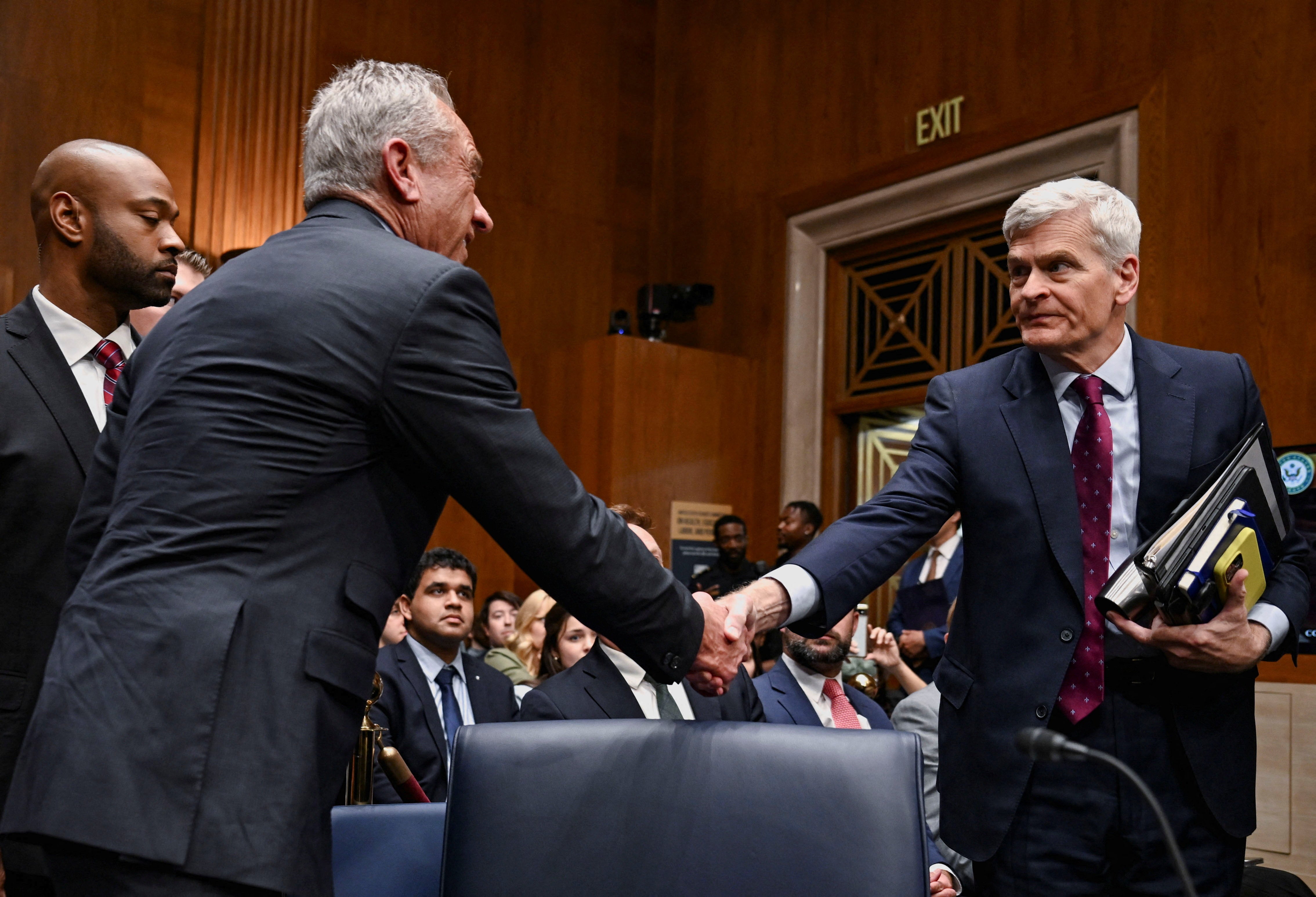 U.S. Health and Human Services (HHS) Secretary Robert F. Kennedy Jr. shakes hands with U.S. Senator Bill Cassidy