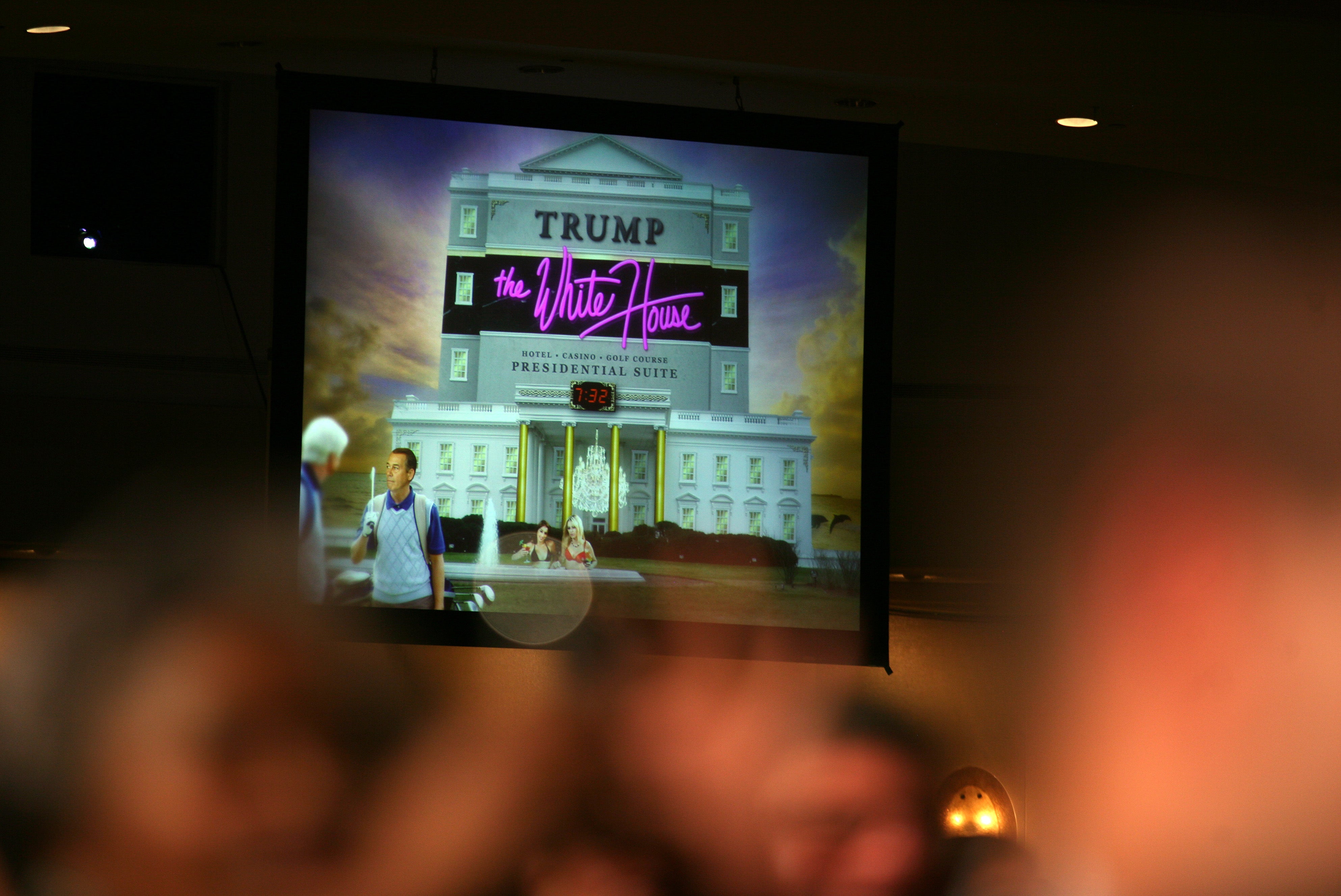 A projected image is shown on a large screen during Barack Obama's speech at the 2011 dinner which Obama used to show what a ‘Trump’ White House might look like