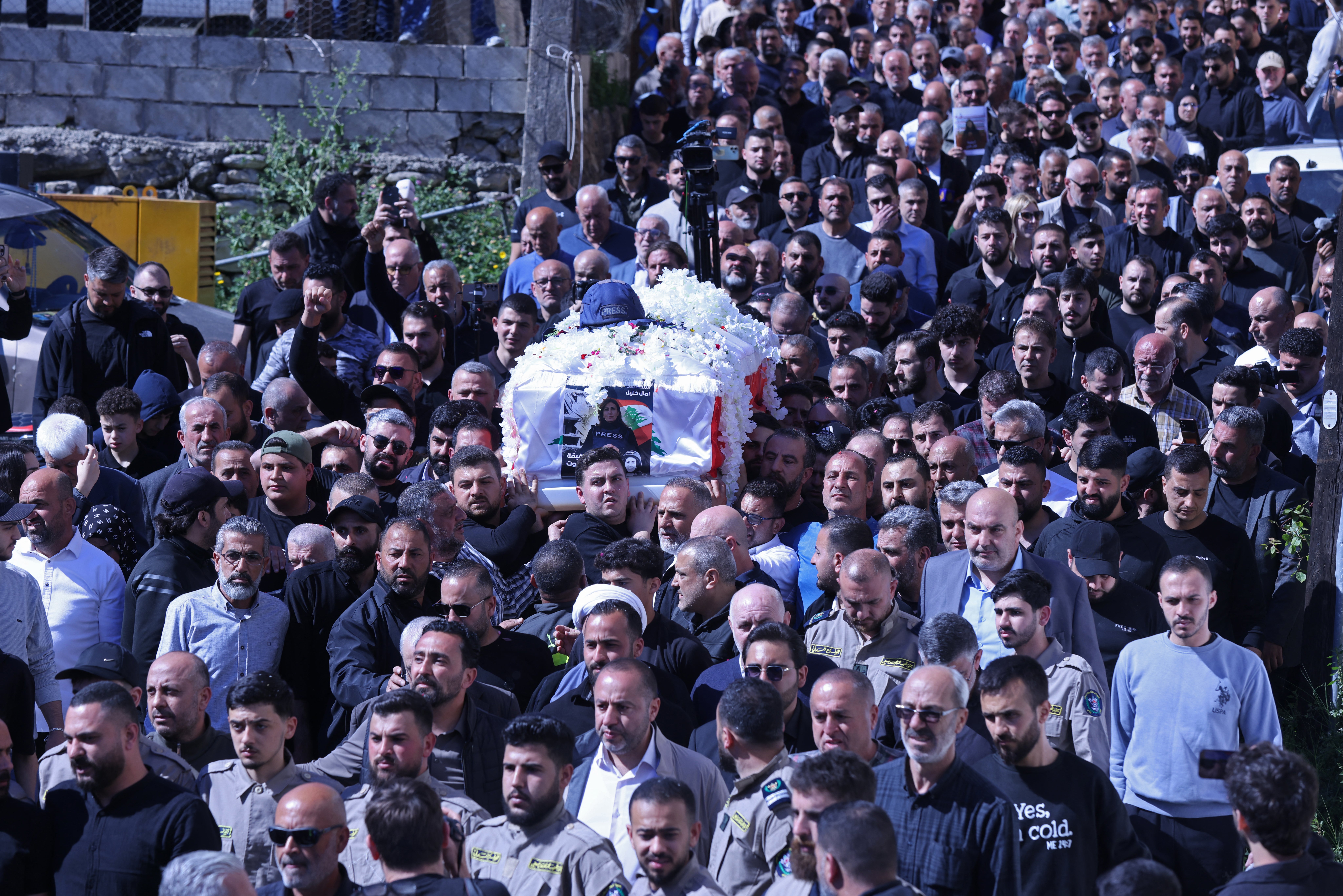 Mourners carry Khalil’s coffin during her funeral procession in Bissariye town, south of Sidon, on 23 April