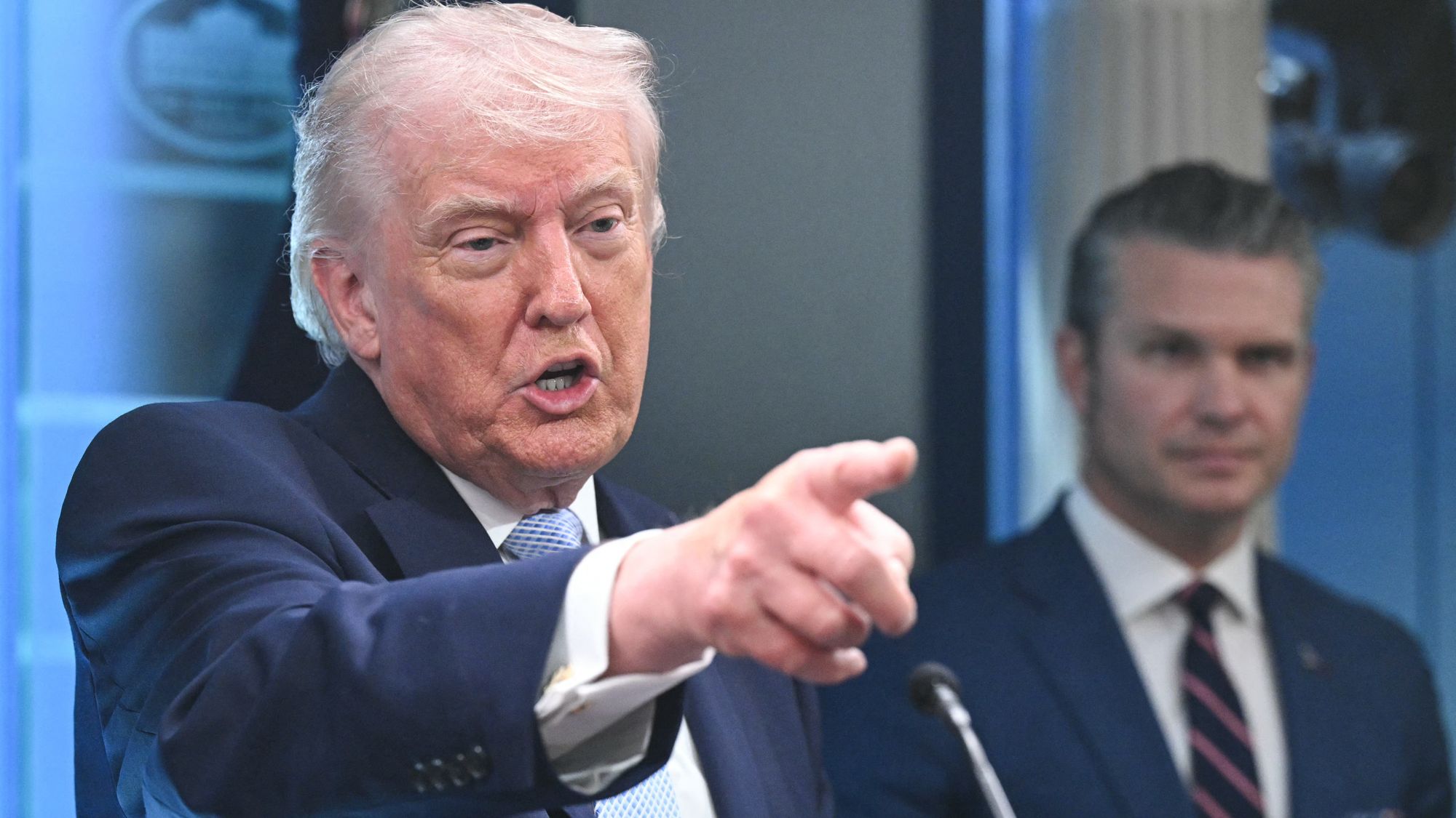 US President Donald Trump, alongside Secretary of Defense Pete Hegseth, speaks about the conflict in Iran in the James S. Brady Press Briefing Room of the White House on April 6, 2026, in Washington, DC. (Photo by SAUL LOEB / AFP via Getty Images)