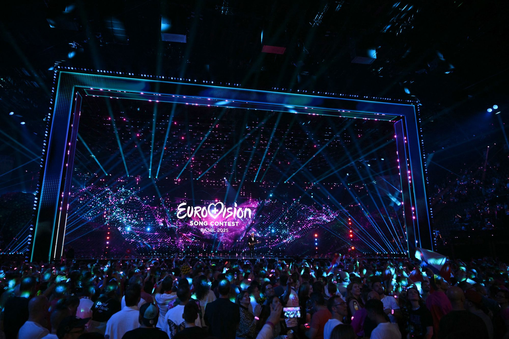 Fans watch the screen at the end of the first semi-final of the Eurovision Song Contest 2025, at the St. Jakobshalle arena in Basel on May 13, 2025