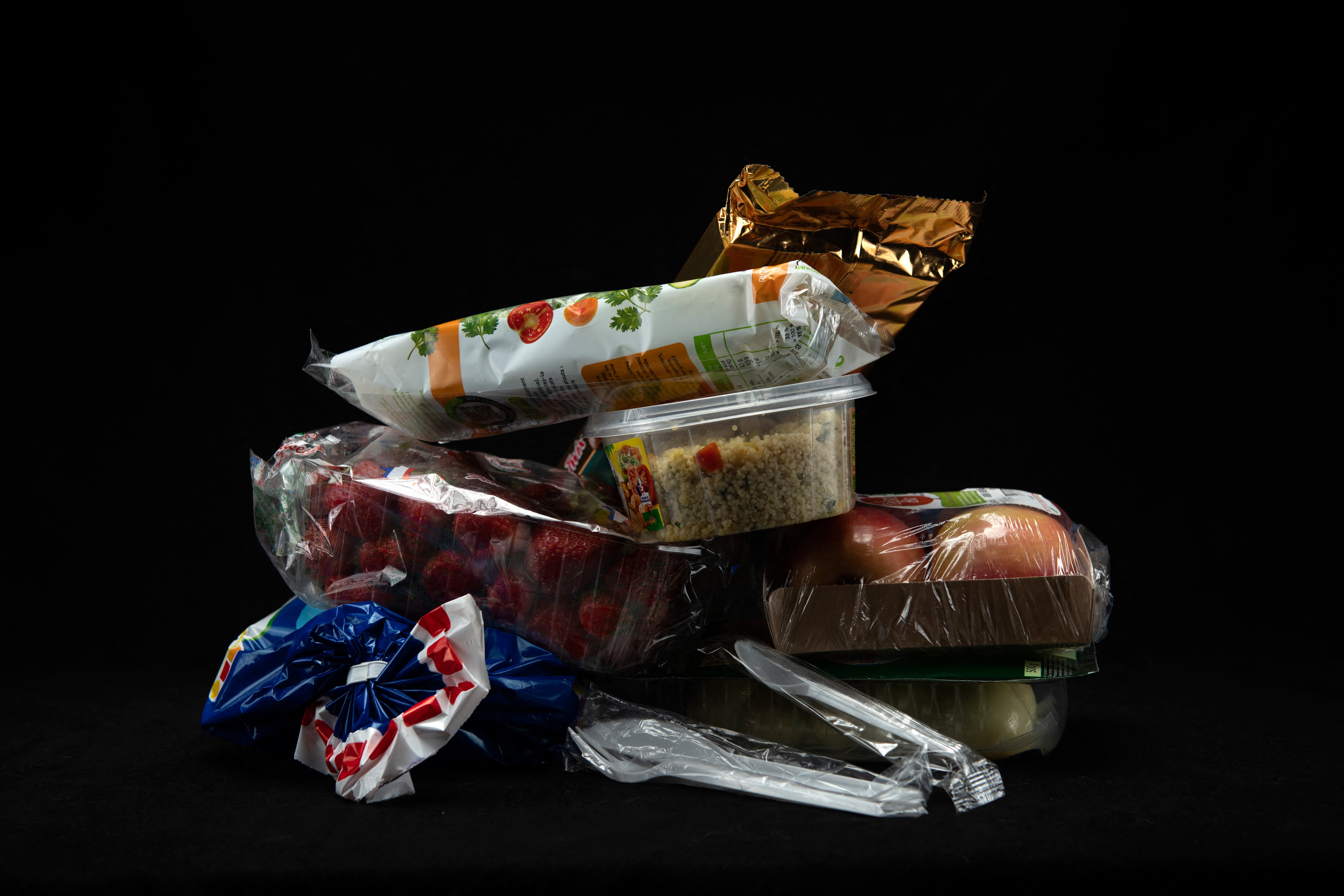 Illustration shows foods wrapped in plastic packaging