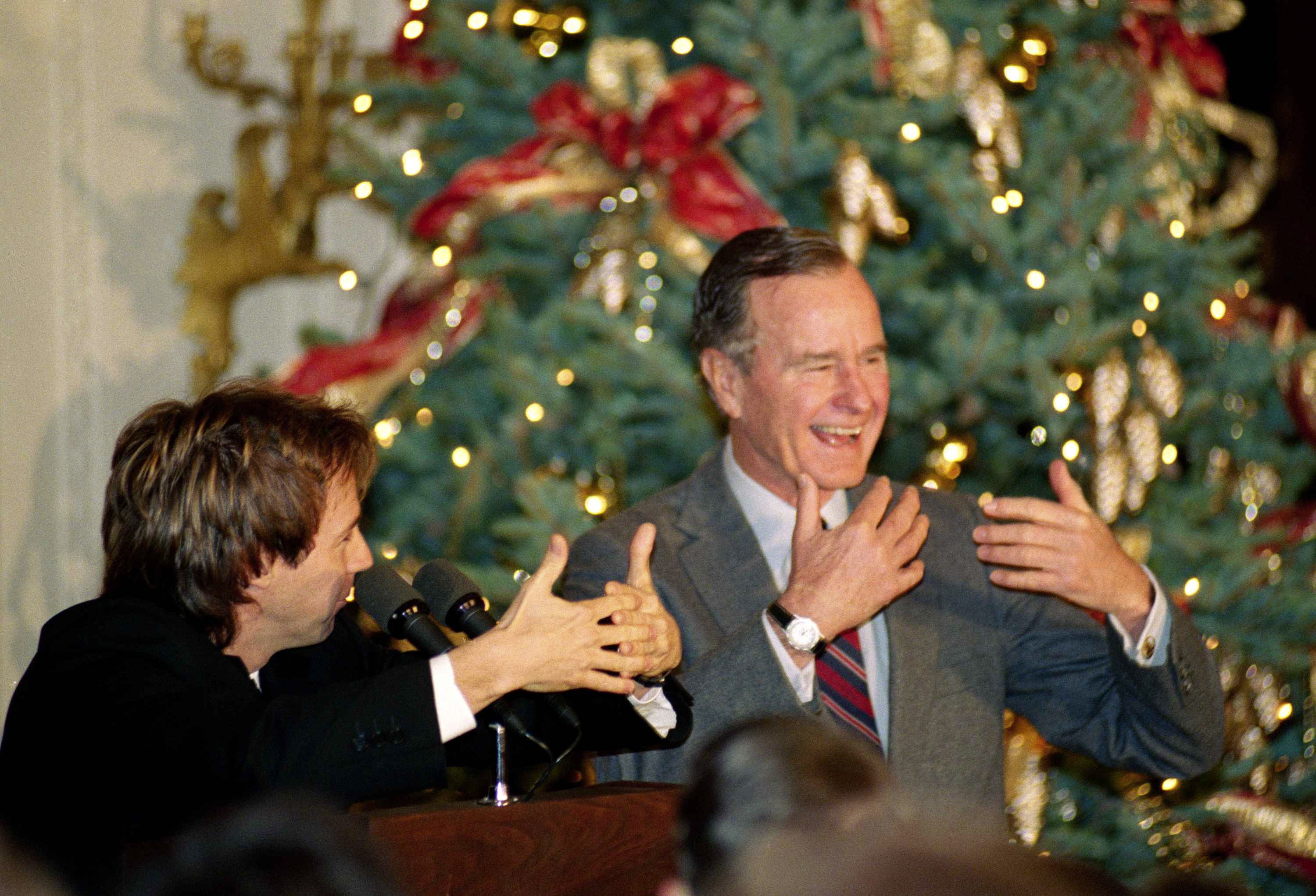 Comic Dana Carvey, left, shows President George H.W. Bush how to imitate himself
