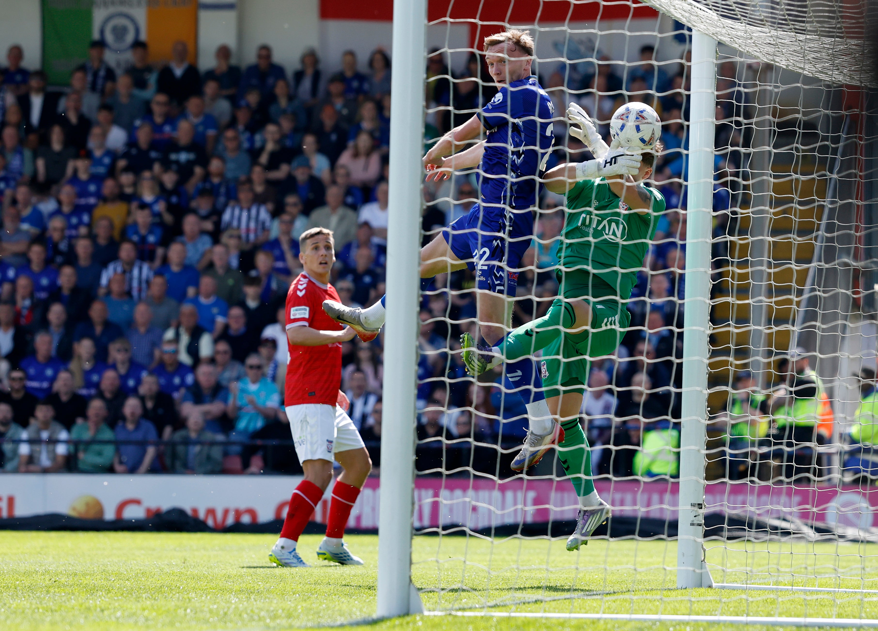 Dan Moss clattered into York goalkeeper Harrison Male to illegally force the ball over the line