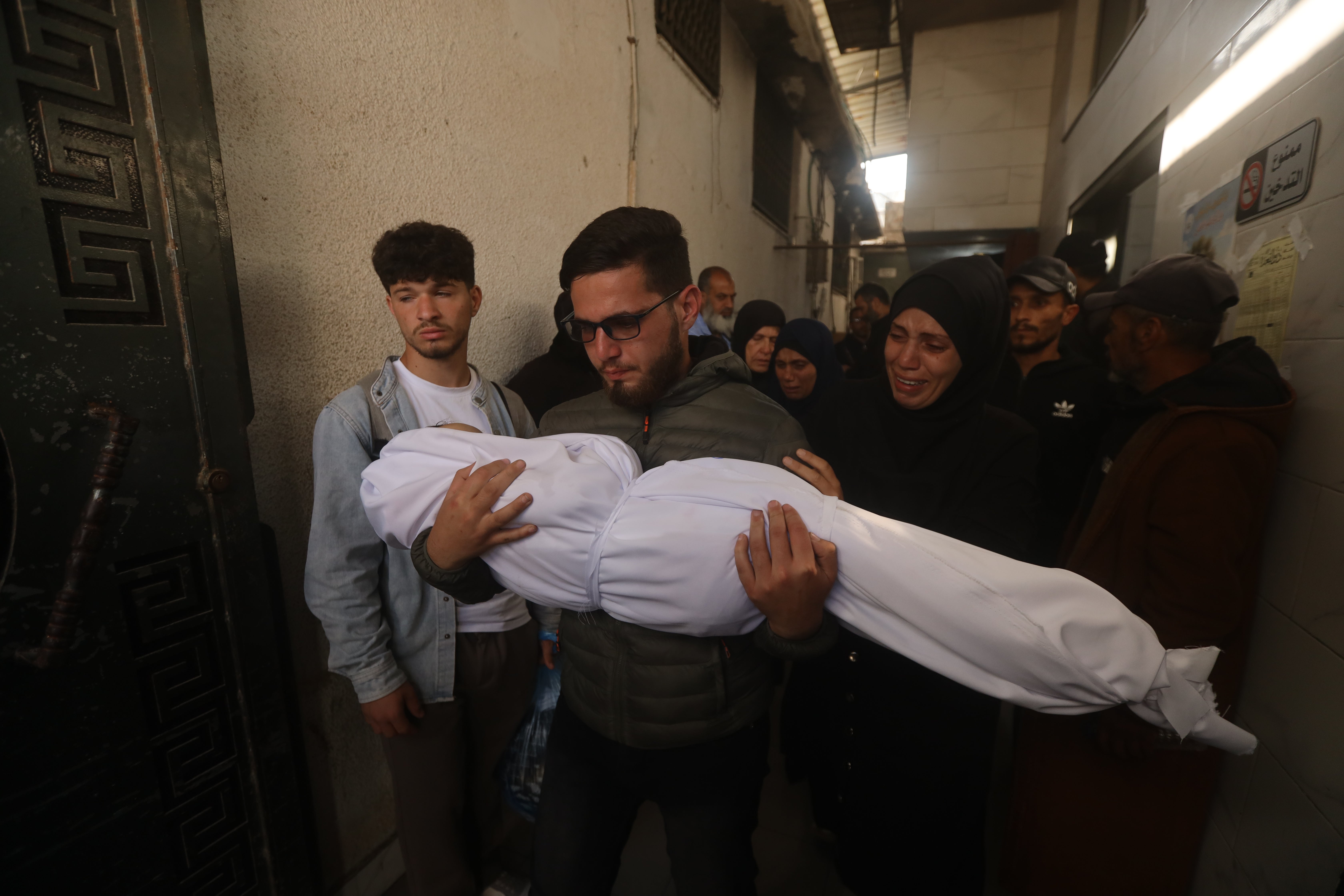Palestinians hold funerals for pregnant woman and her children killed ...