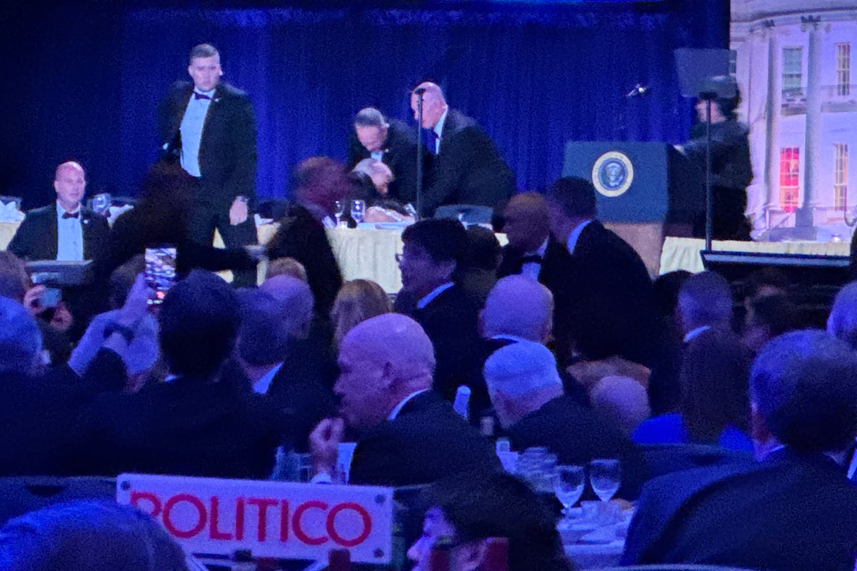 Moment Donald Trump is rushed off the stage after shots at White House Correspondents Dinner