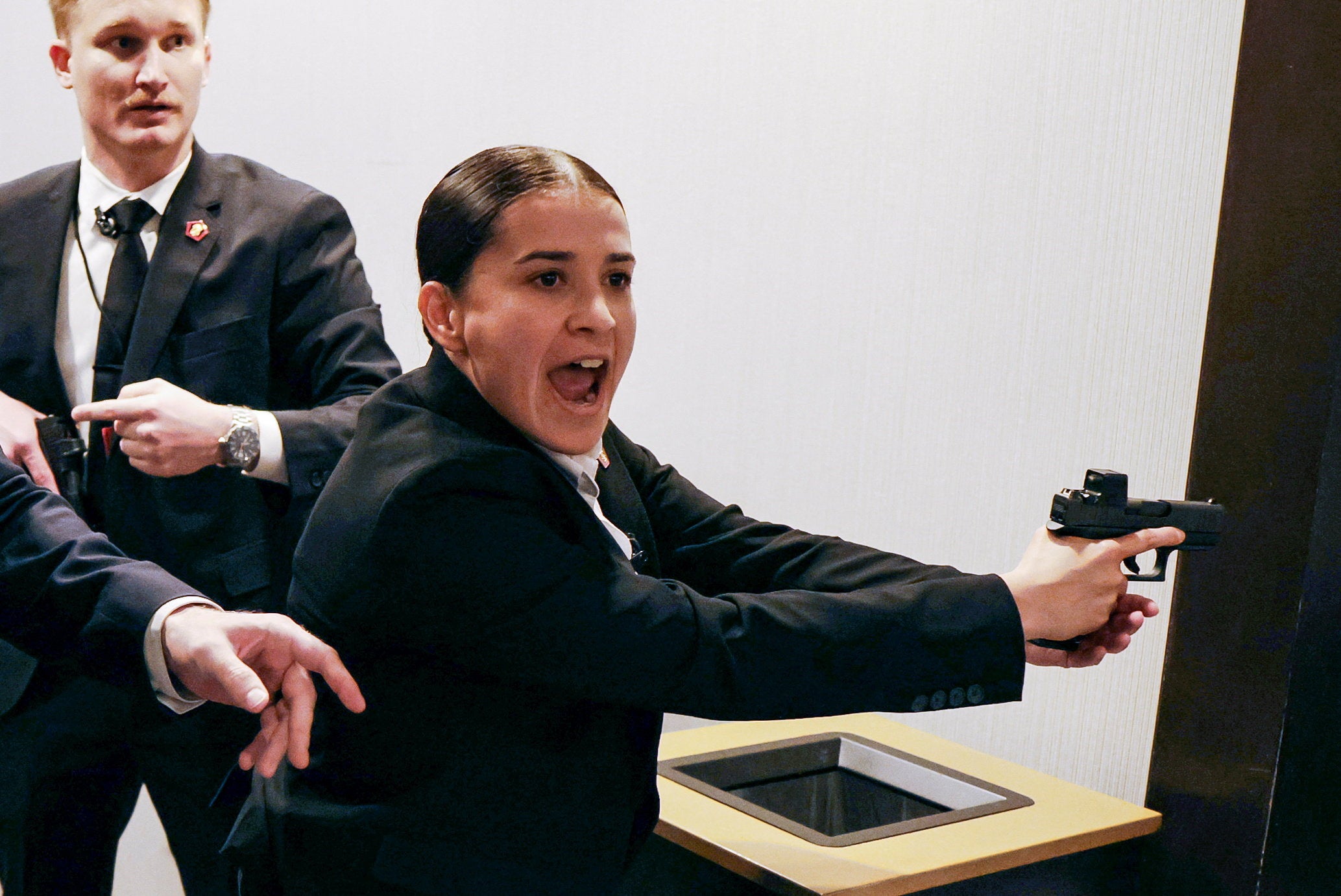 Secret Service agents rushing the ballroom with their guns drawn made it very apparent the pops and crashing sound was not a waiter dropping a tray of drinking glasses.