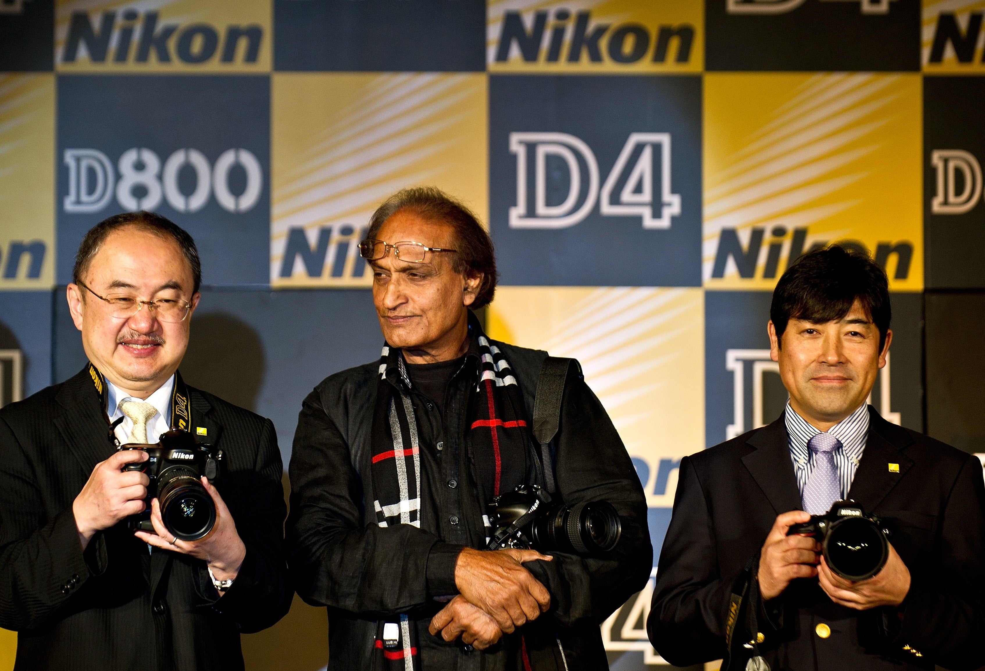 File: Managing Director Nikon India Hiroshi Takashina (L), veteran Indian photographer Raghu Rai (C) and general manager Marketing Nikon Corporation Toru Iwaoka (R) pose wth the newly launched Nikon D4 and D800/D800E DSLR cameras in New Delhi in 2012