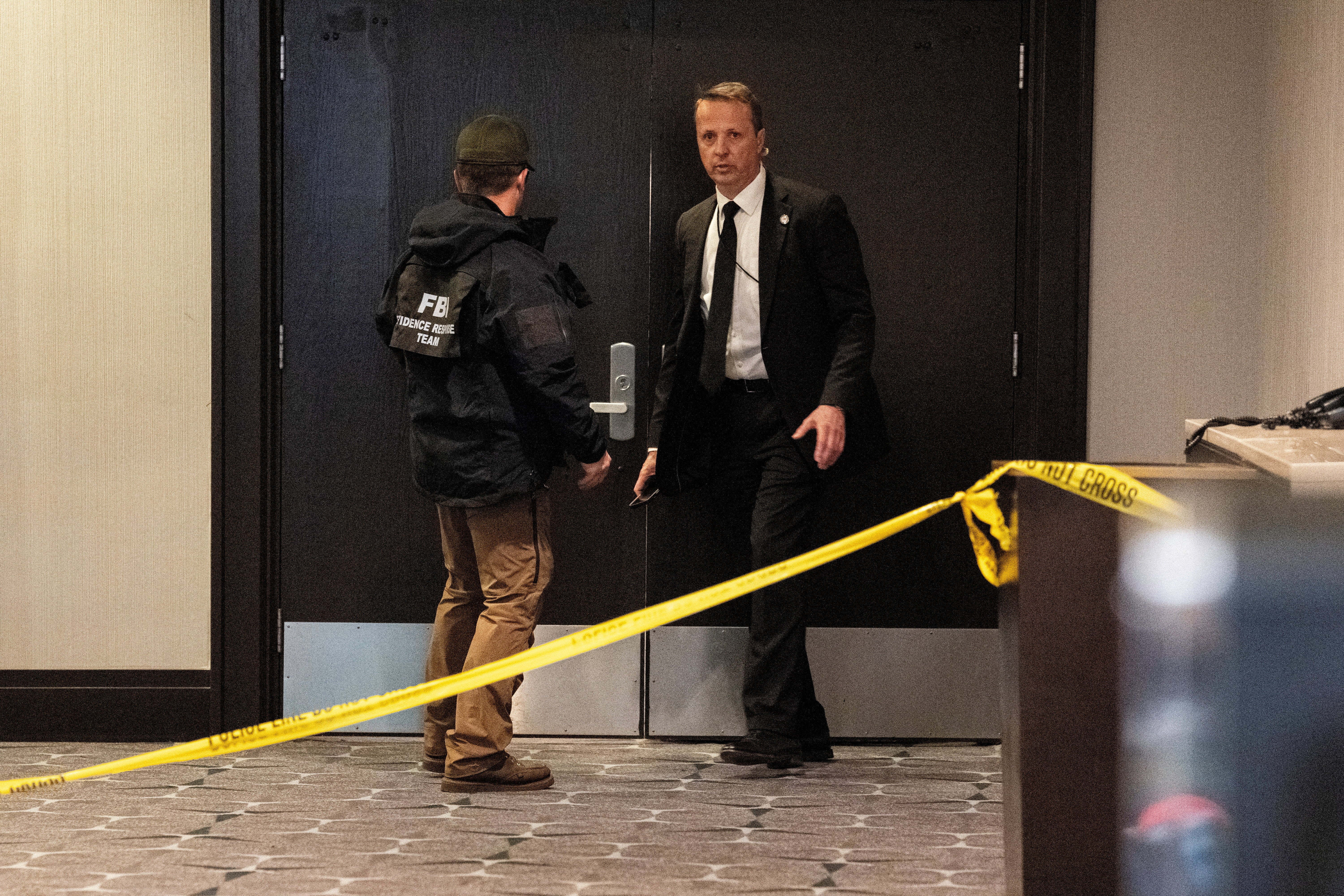 FBI personnel patrol the venue, following a shooting incident during the annual White House Correspondents' Association dinner, in Washington, DC, US, 25 April 2026