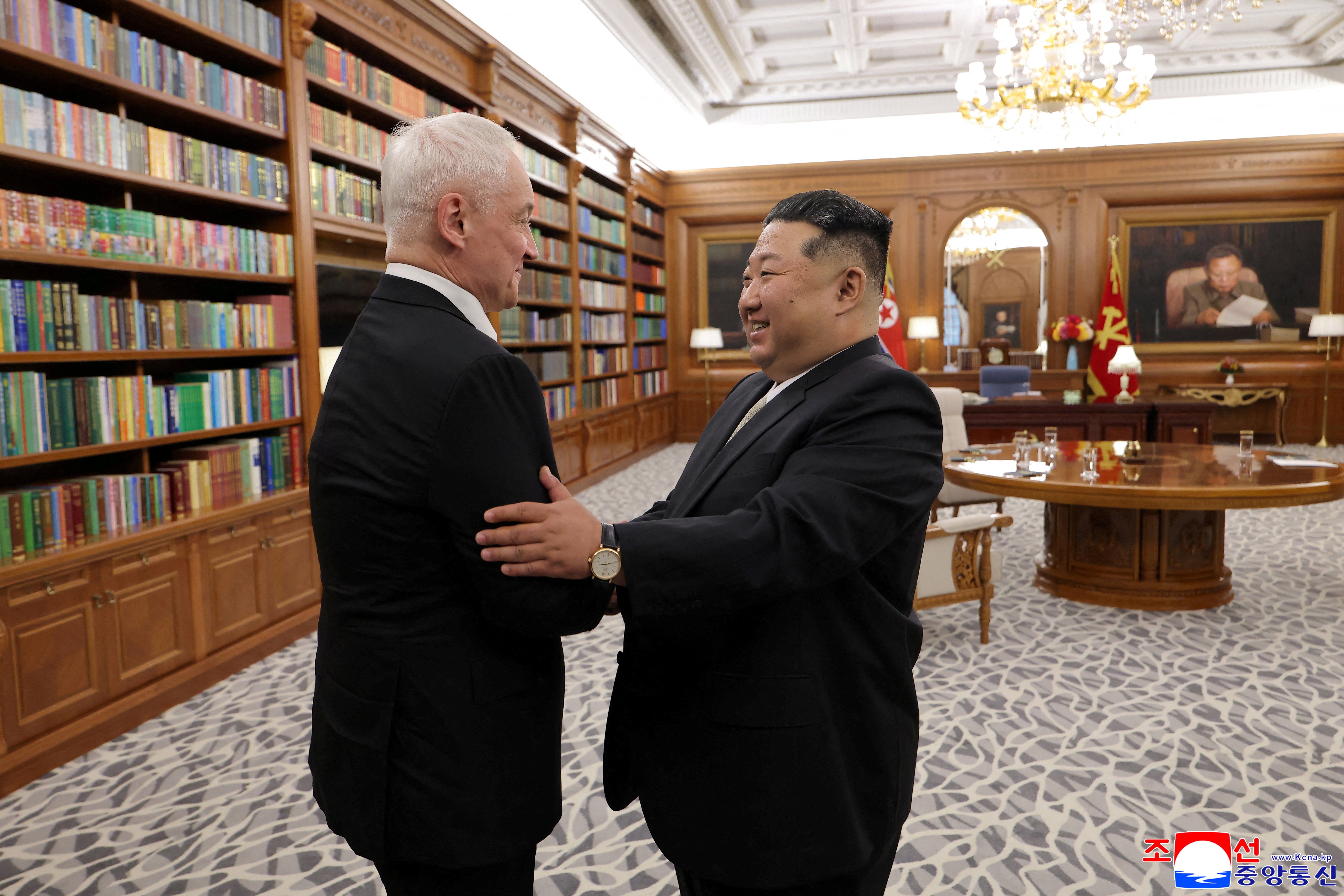 Kim Jong Un greets Russia's defence minister Andrei Belousov during Belousov's visit in Pyongyang