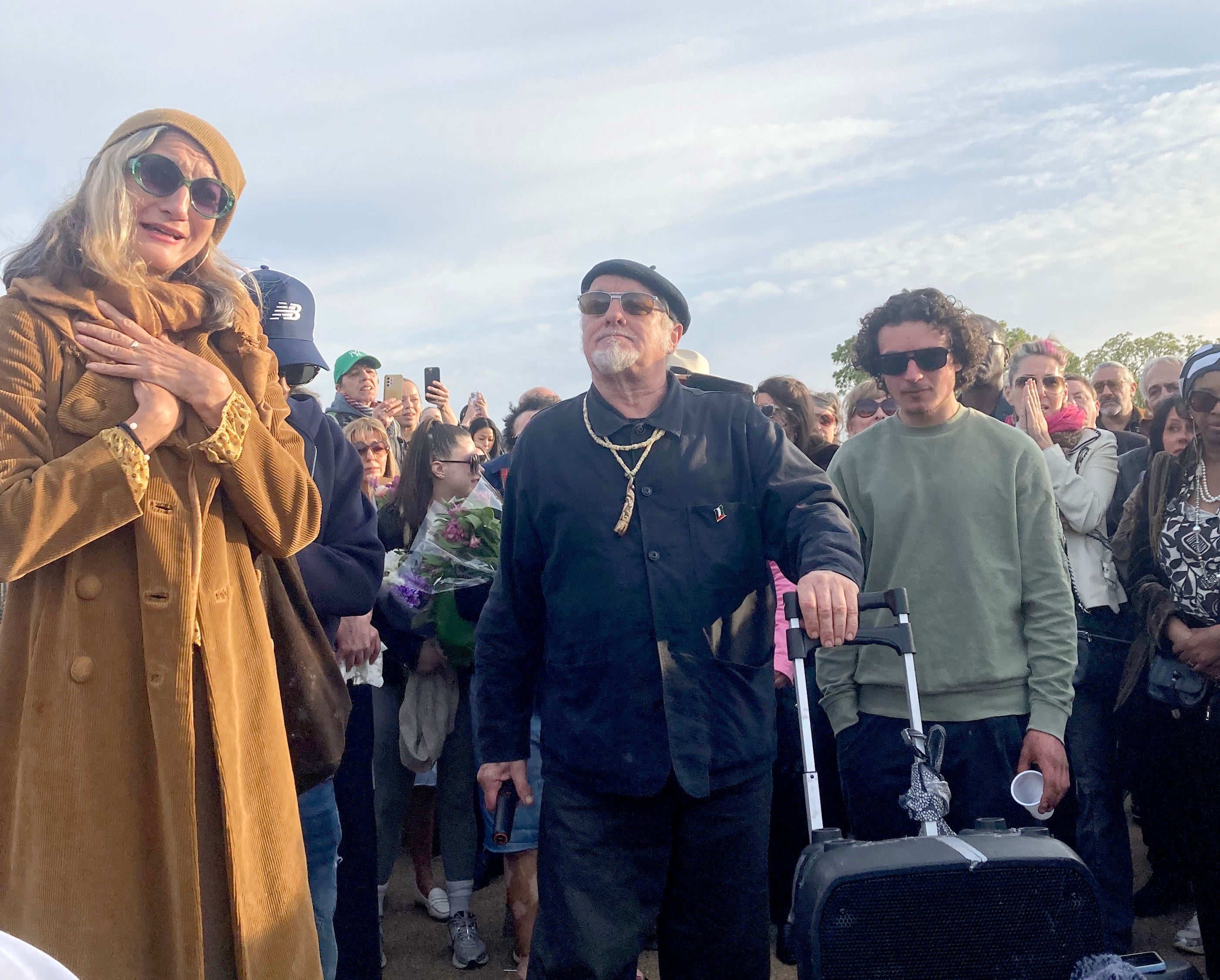 Finbar Sullivan's parents Leah Seresin (left) and Chris Sullivan (centre) join a vigil on Primrose Hill, north London, in memory of the 21-year-old filmmaking student