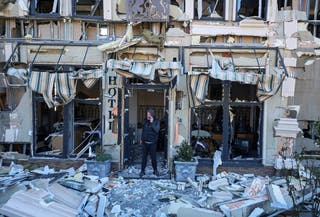 A man stands in a hotel hit by a Russian drone strike