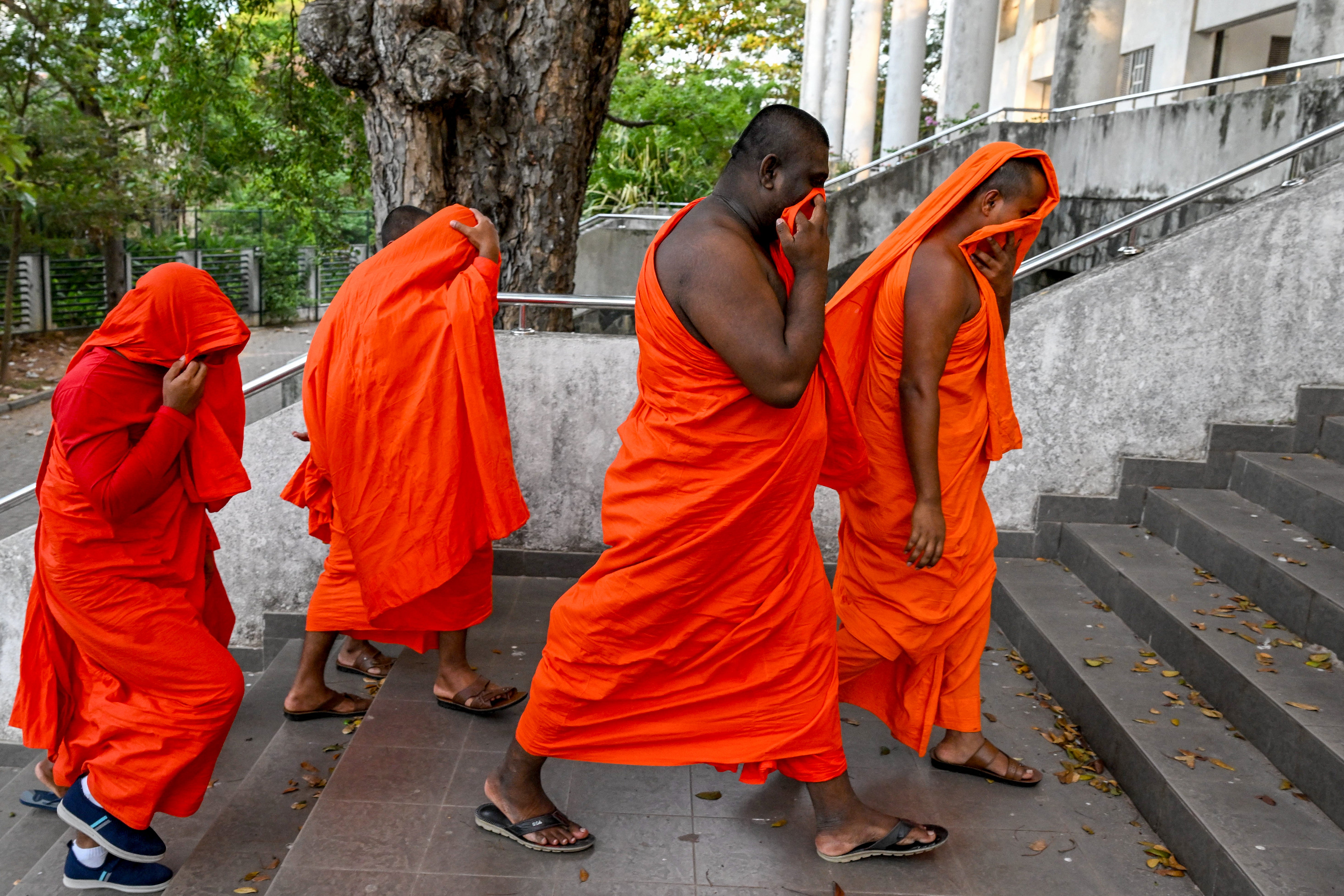 Sri Lankan monks arrive to appear before a court after their arrest in Negombo on 26 April 2026