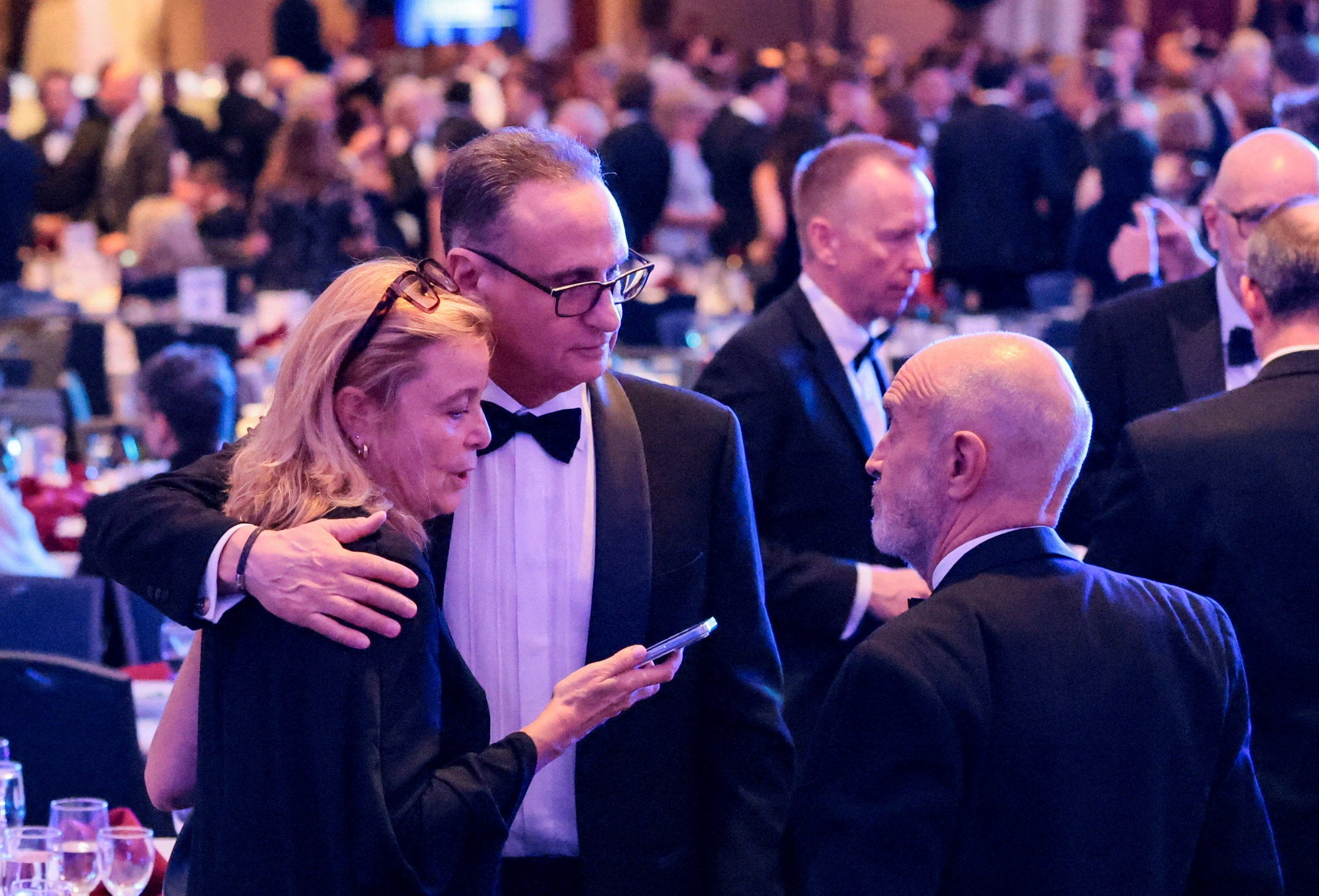 Journalists comforting one another on what proved to be a distressing evening for attendees