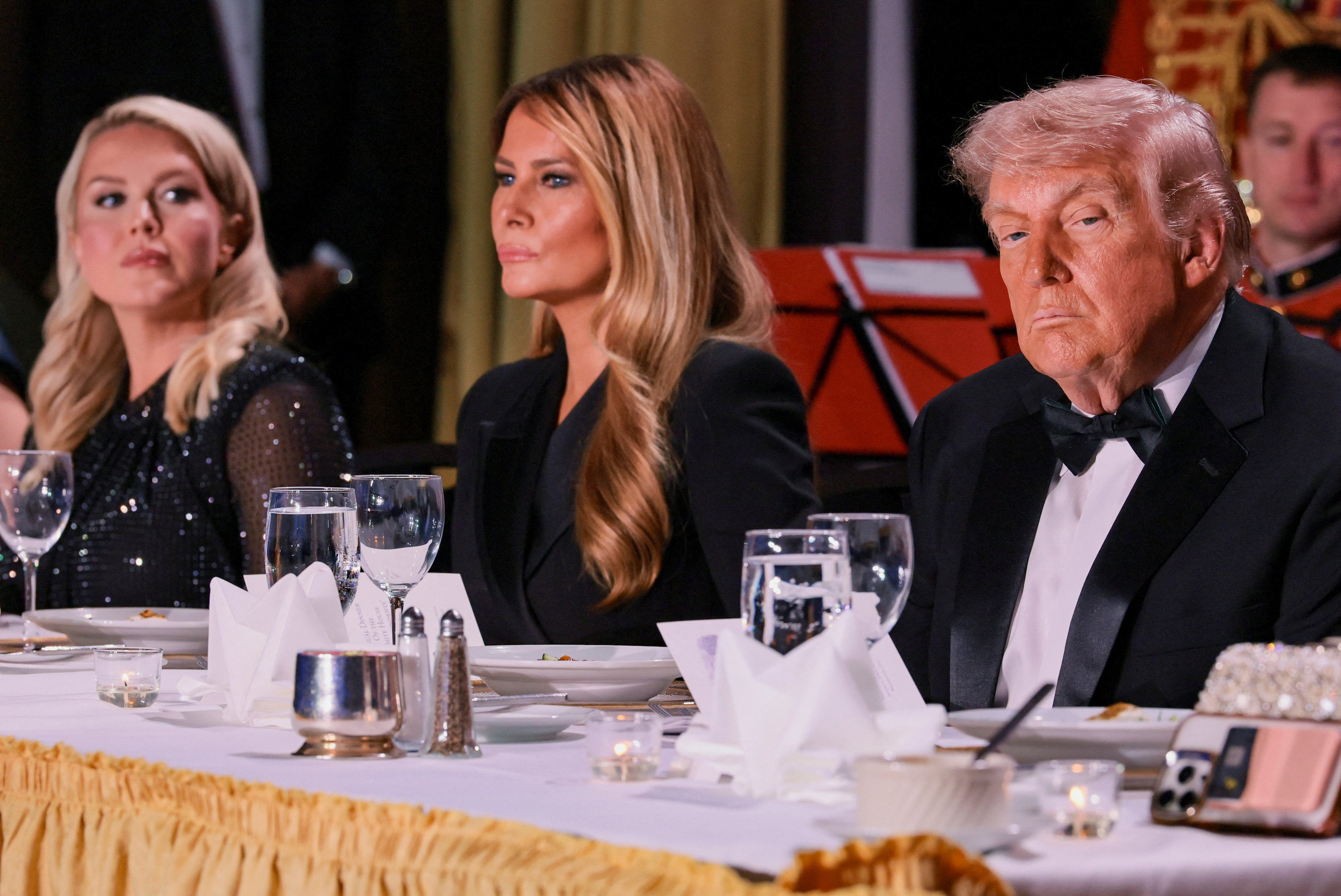 President Donald Trump (pictured on the dais with first lady Melania and White House press secretary Karoline Leavitt before the shooting began) wanted to return to the event after with a ‘speech of love’ for the press.