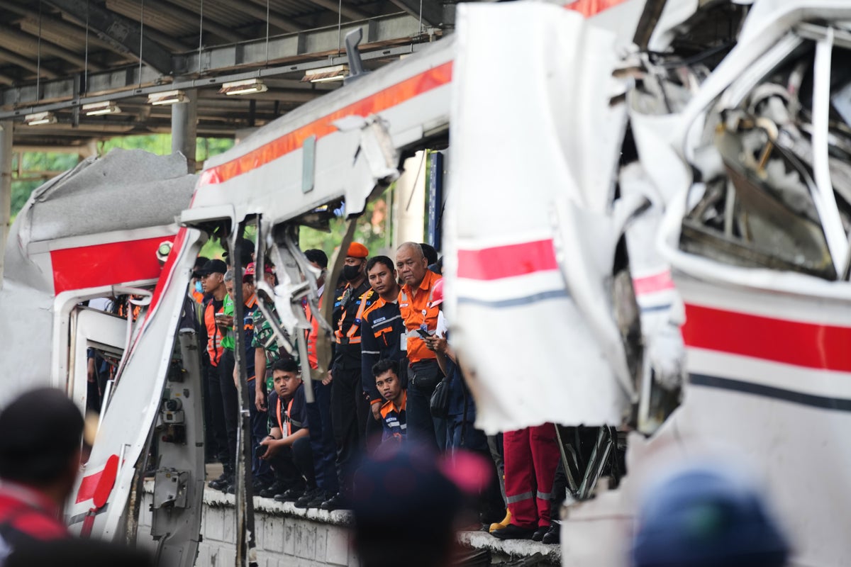 Rescuers recover victims from an Indonesia train crash, in photos