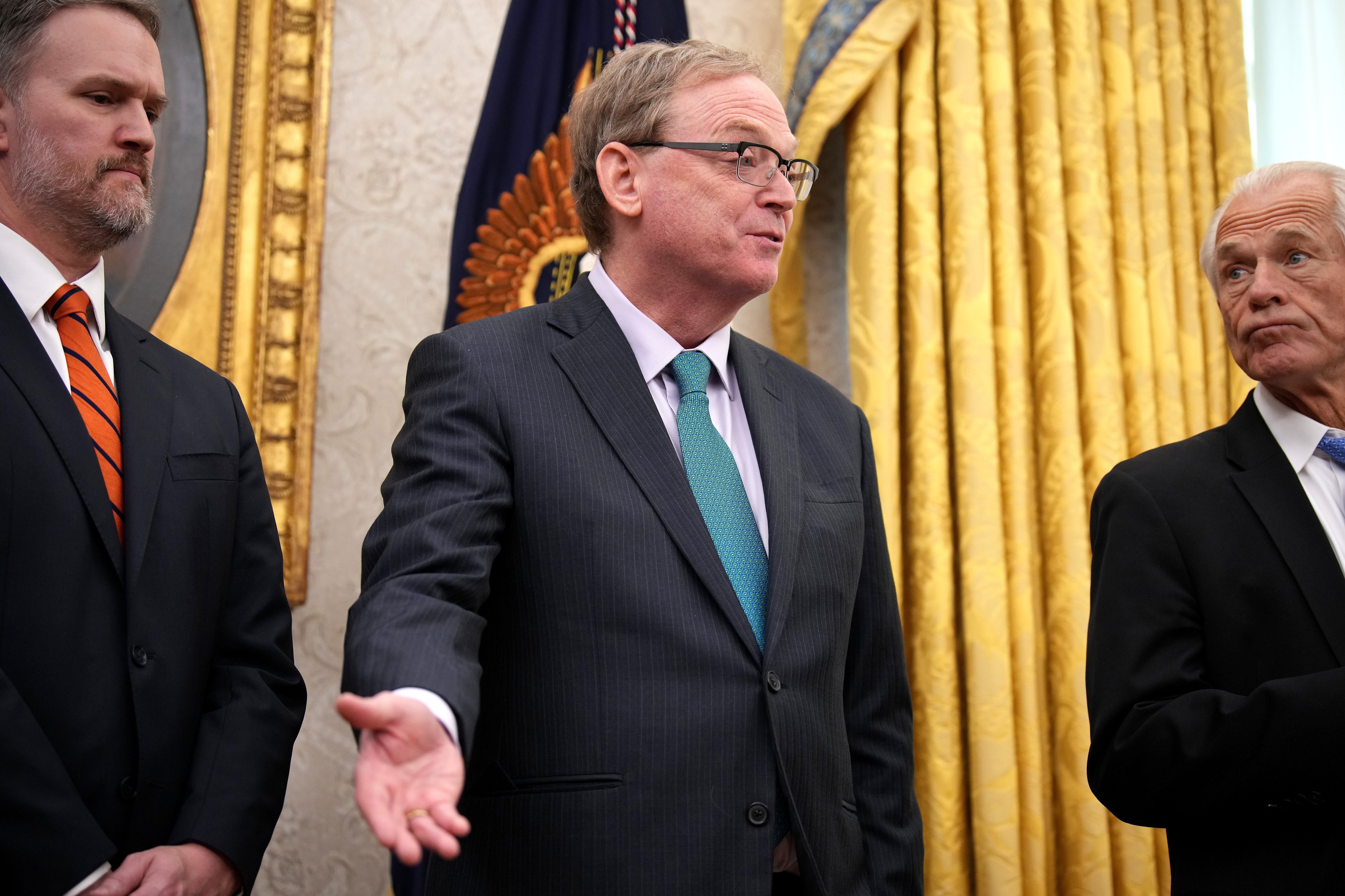 Director of the National Economic Council Kevin Hassett (C), joined by U.S. Trade Representative Jamison Greer (L) and trade advisor Peter Navarro, speaks after President Donald Trump signed an executive order on reciprocal tariffs in February