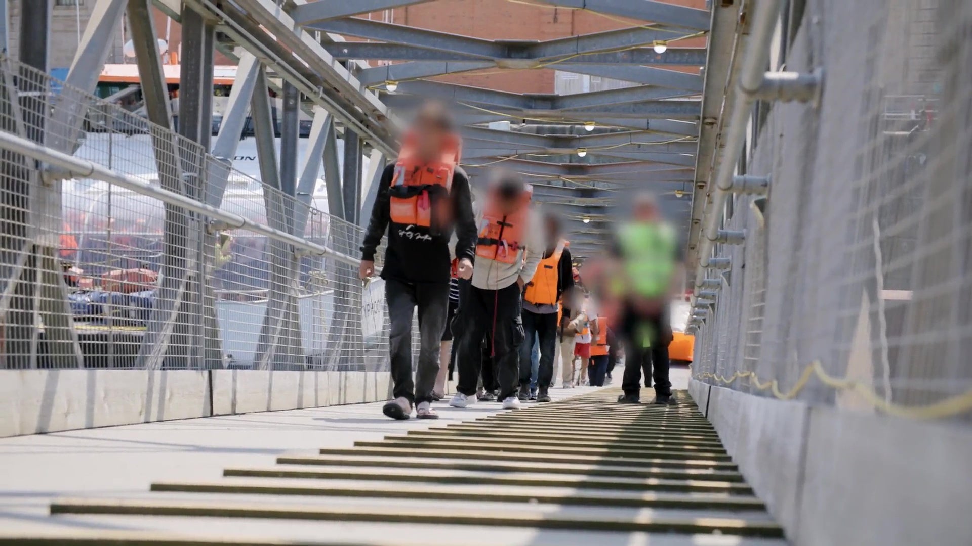 Screen grab taken from video issued by the Home Office of the first small boat migrants detained under the UK’s new ‘one in, one out’ deal, at Western Jet Foil in Dover, Kent