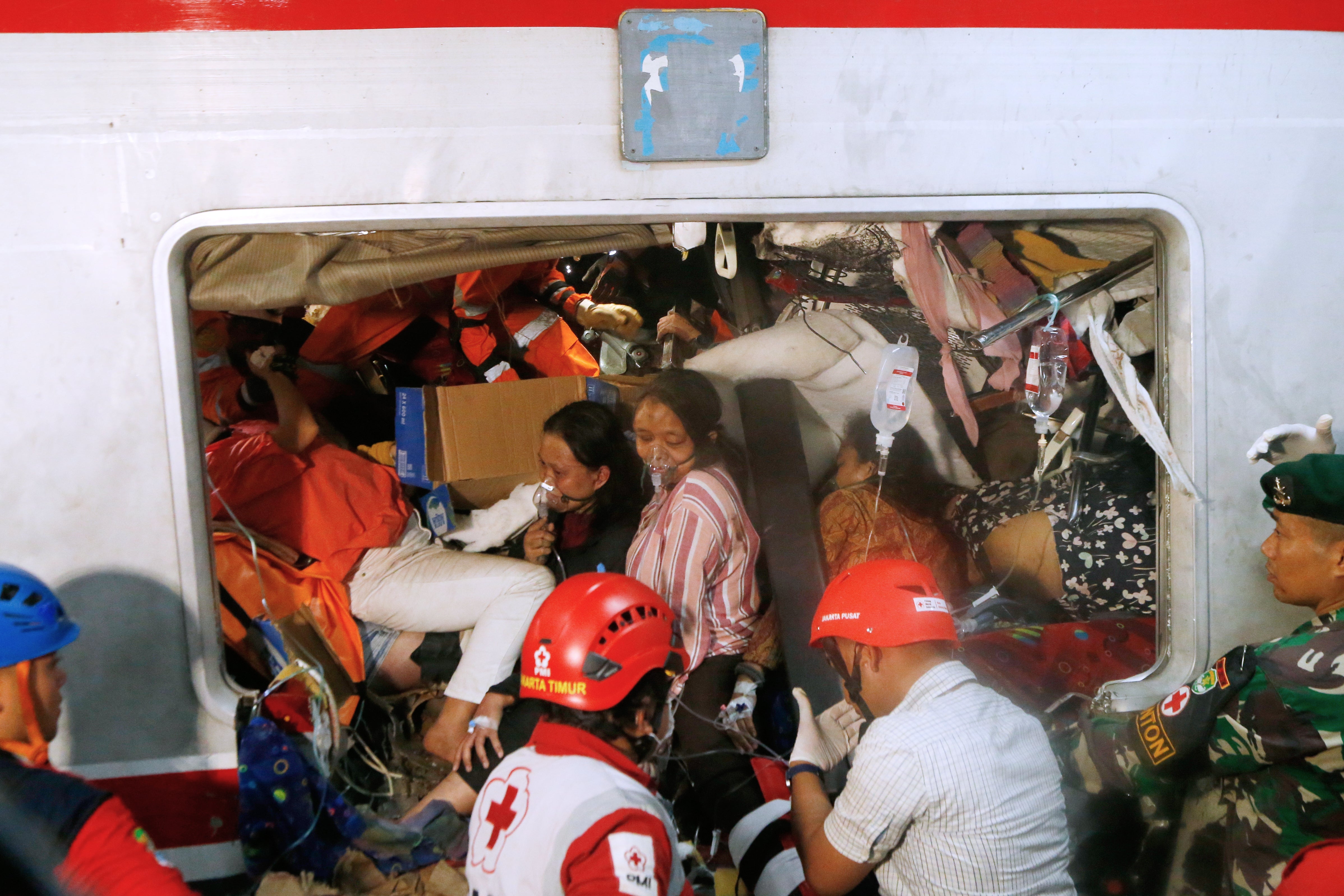 Passengers are seen being rescued after the train crash in Bekasi, Indonesia
