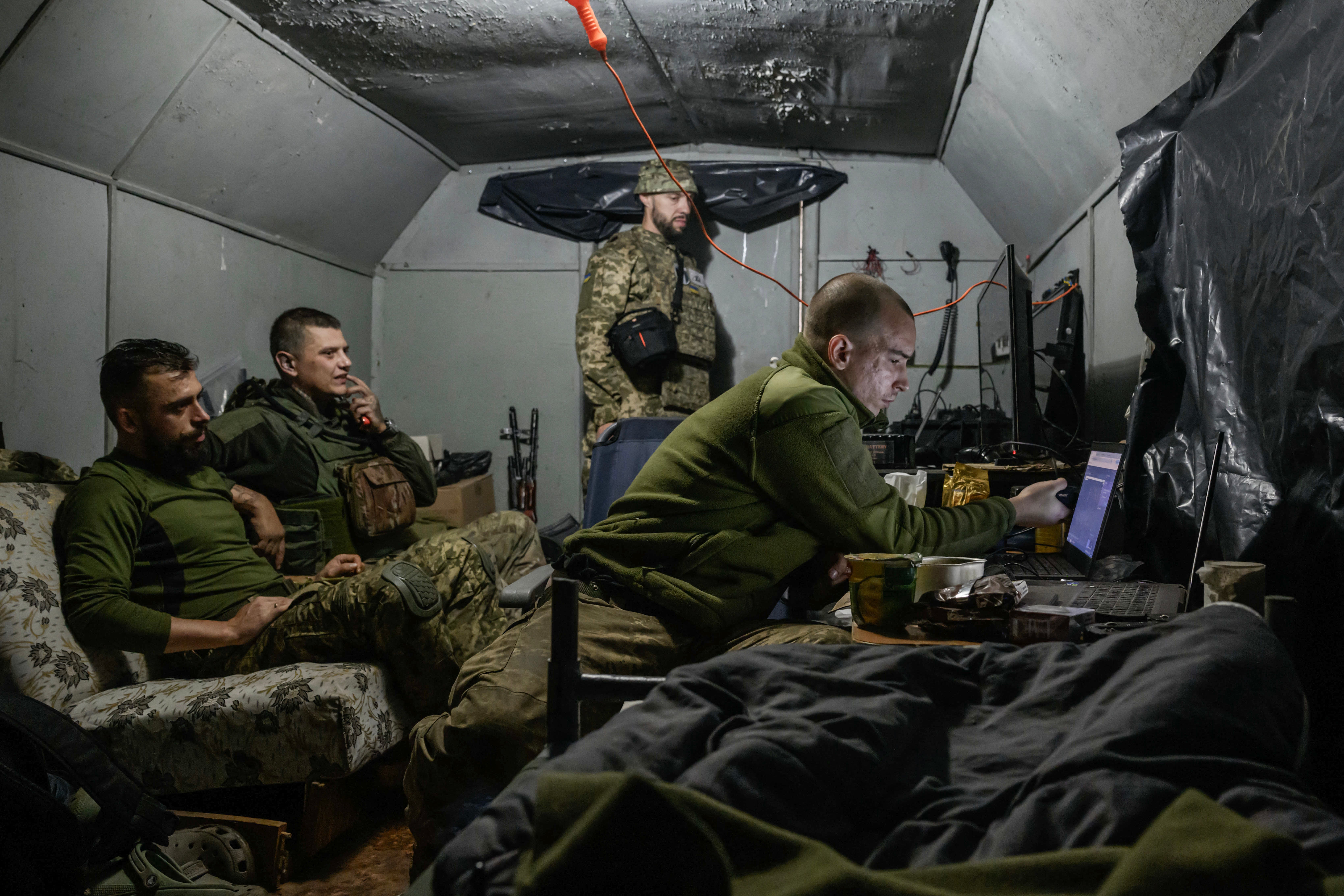 Members of the 3rd Army Corps Interception Squadron monitor for Russian drone activity at an undisclosed location near the front lines of eastern Uraine, on October 2025