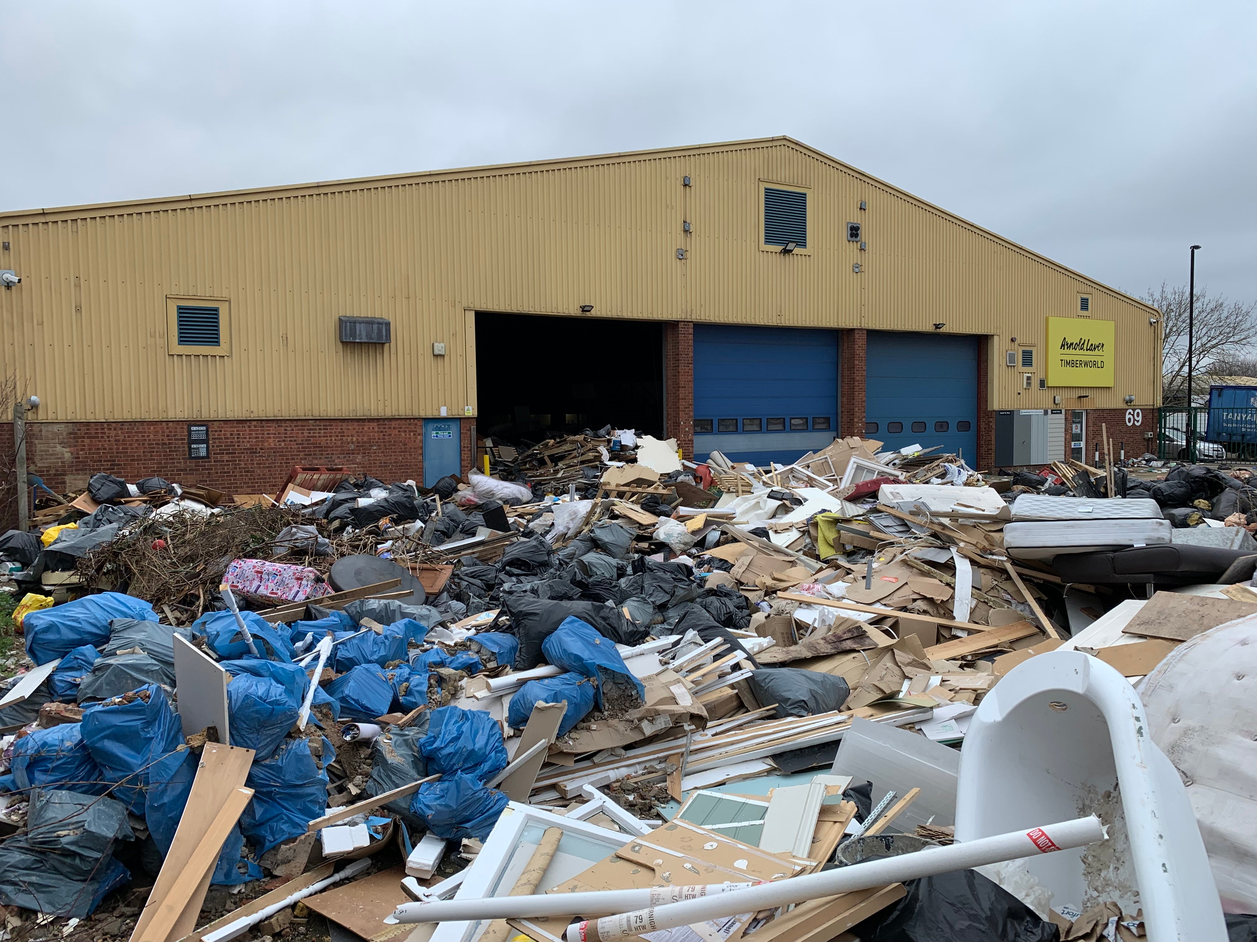 The men directed tipper trucks full of rubbish to dump waste