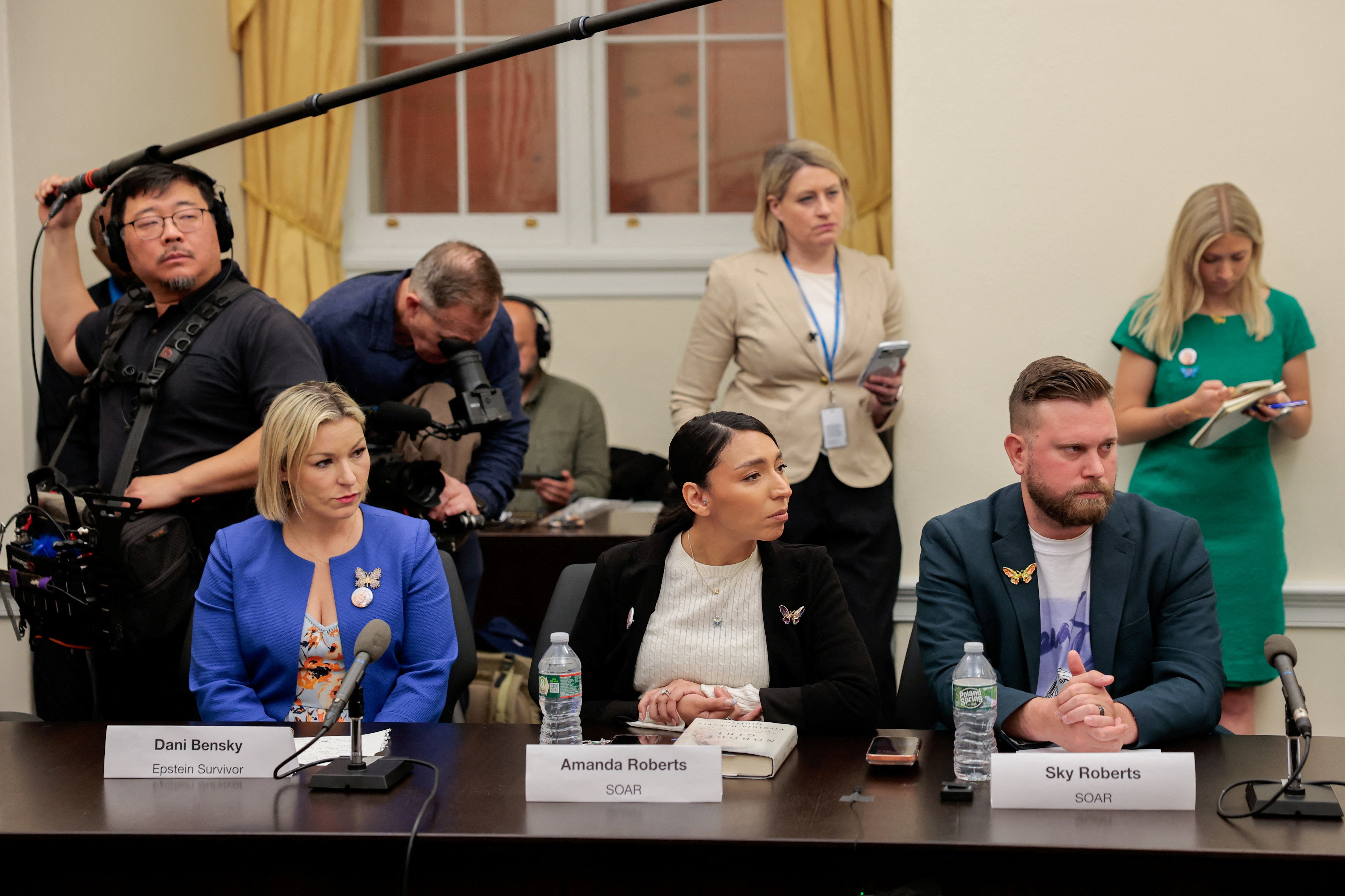 Dani Bensky, a survivor of Jeffrey Epstein, Virginia Giuffre's sister-in-law Amanda Roberts, and Giuffre's brother Sky Roberts attend a roundtable discussion with survivors of Epstein and their families, on Capitol Hill in Washington, D.C., U.S., April 28, 2026. REUTERS/Kylie Cooper