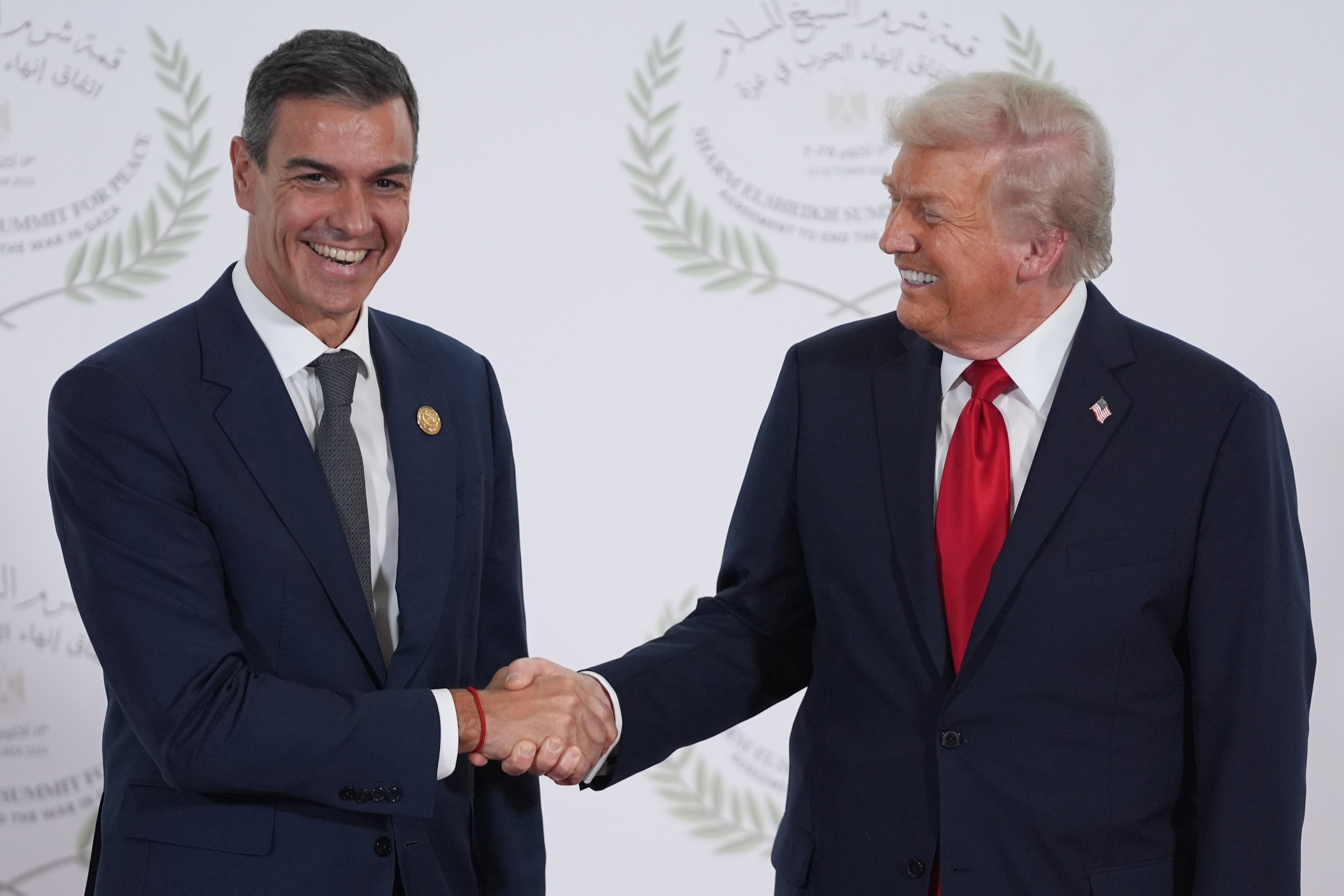 President Donald Trump greets Spain's Prime Minister Pedro Sanchez during a world leaders' summit on ending the Gaza war on October 13