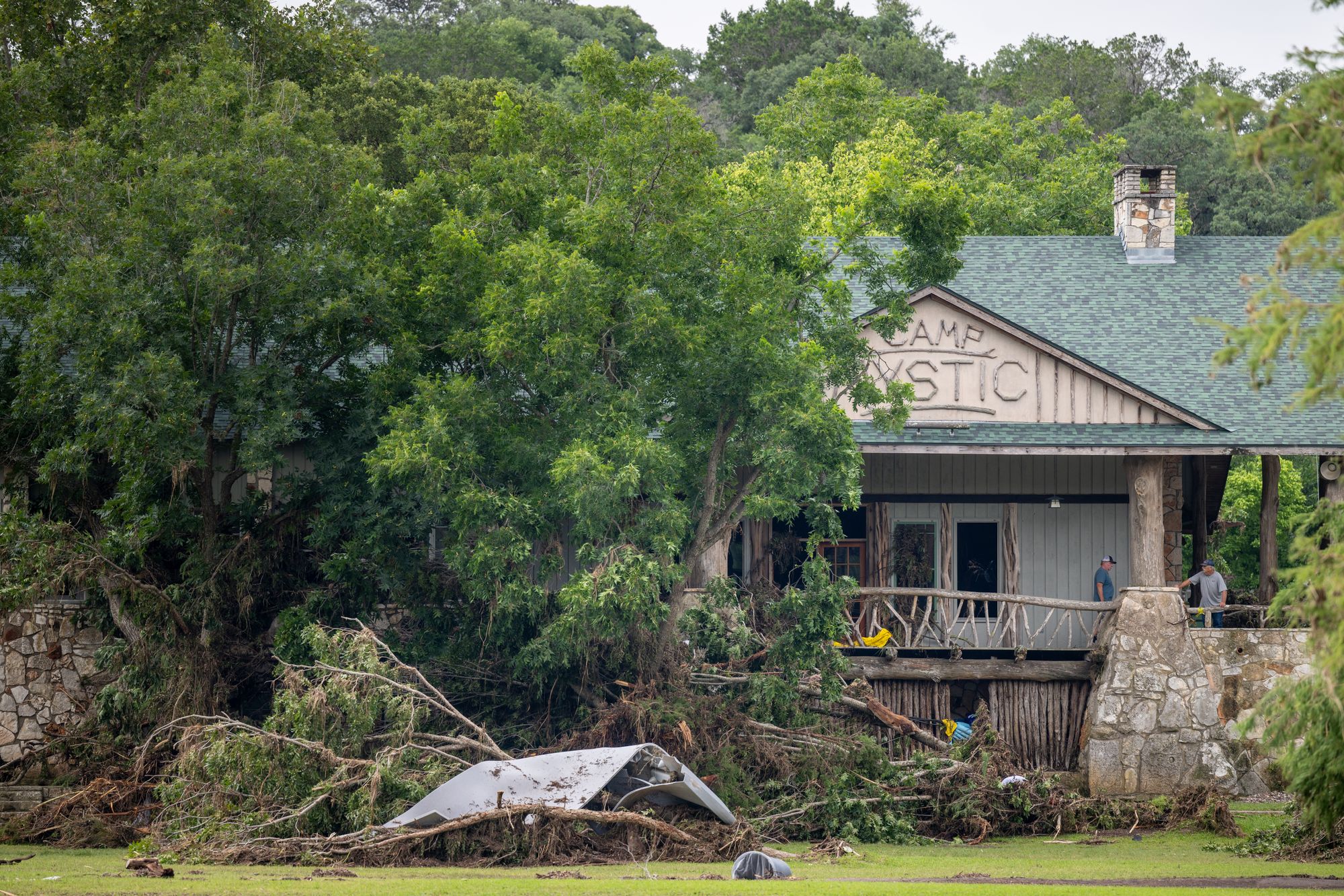 Debris is piled up at the entrance to Camp Mystic on July 7, 2025 in Hunt, Texas after severe flash flooding along the Guadalupe River in central Texas