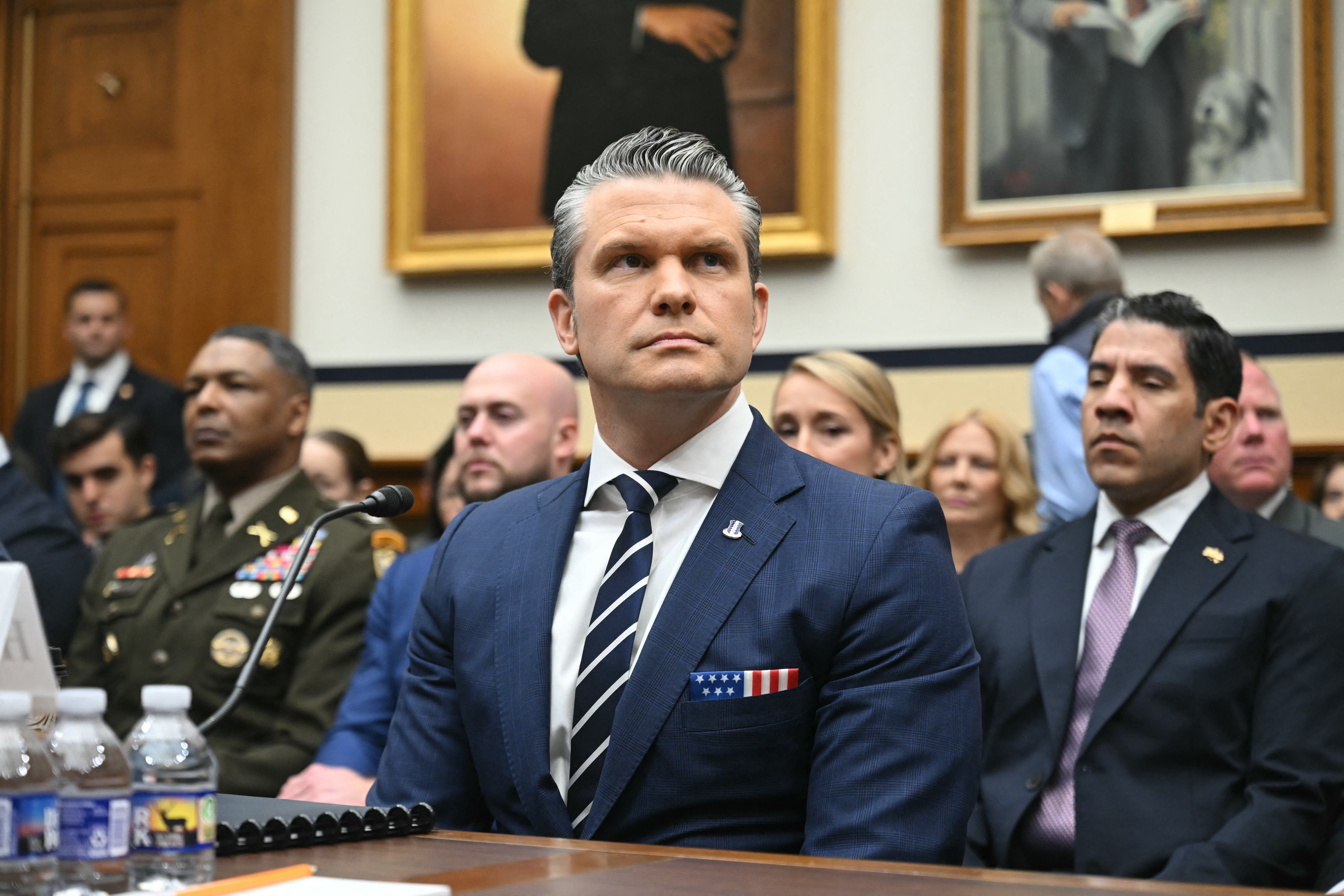 Hegseth takes his seat