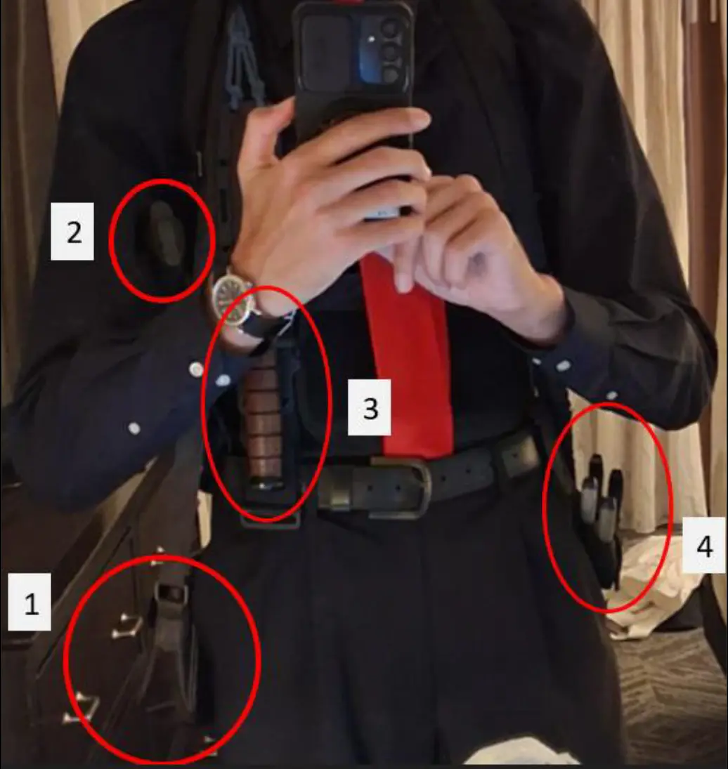 Allen allegedly had two guns and multiple knives on him in the photo, along with additional ammunition, pliers and wire cutters