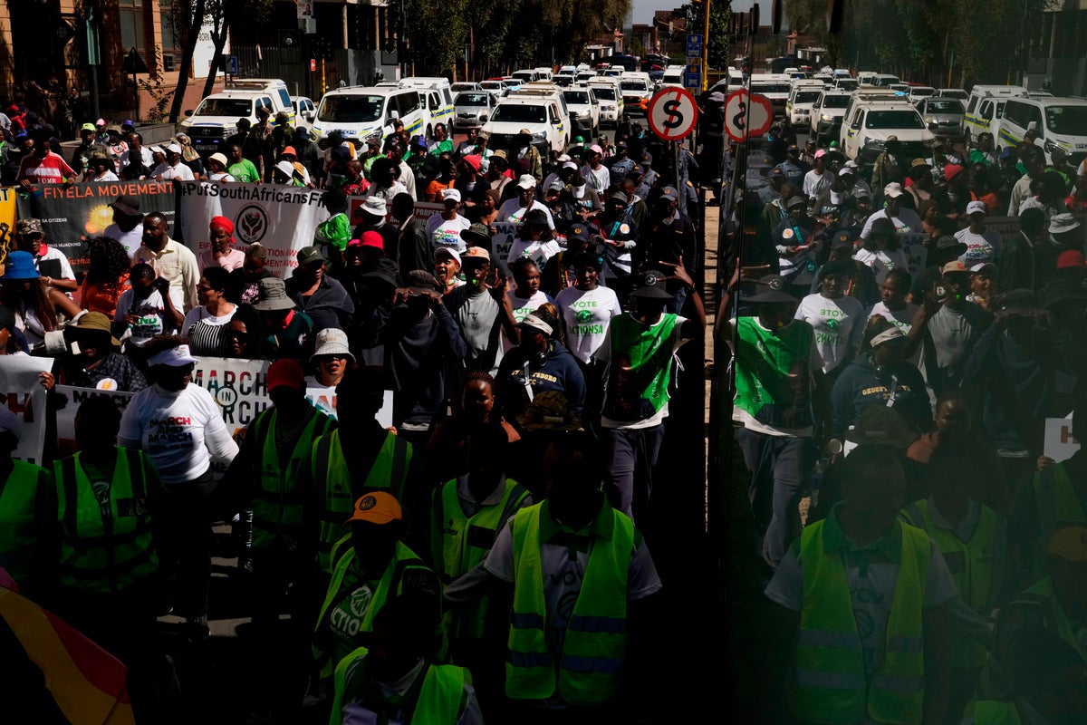 Hundreds march in Johannesburg against illegal migration as shops shut over looting fears