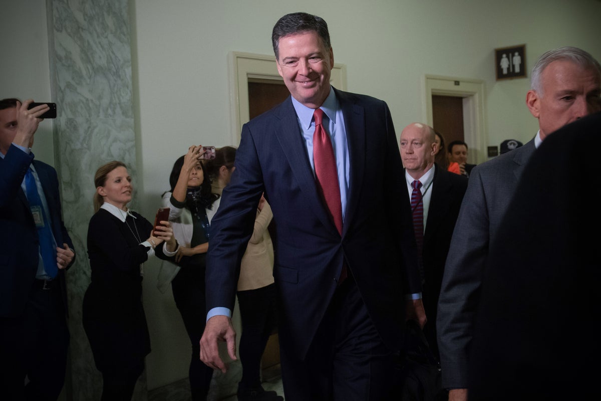 Former FBI Director James Comey surrenders over alleged threat against Trump