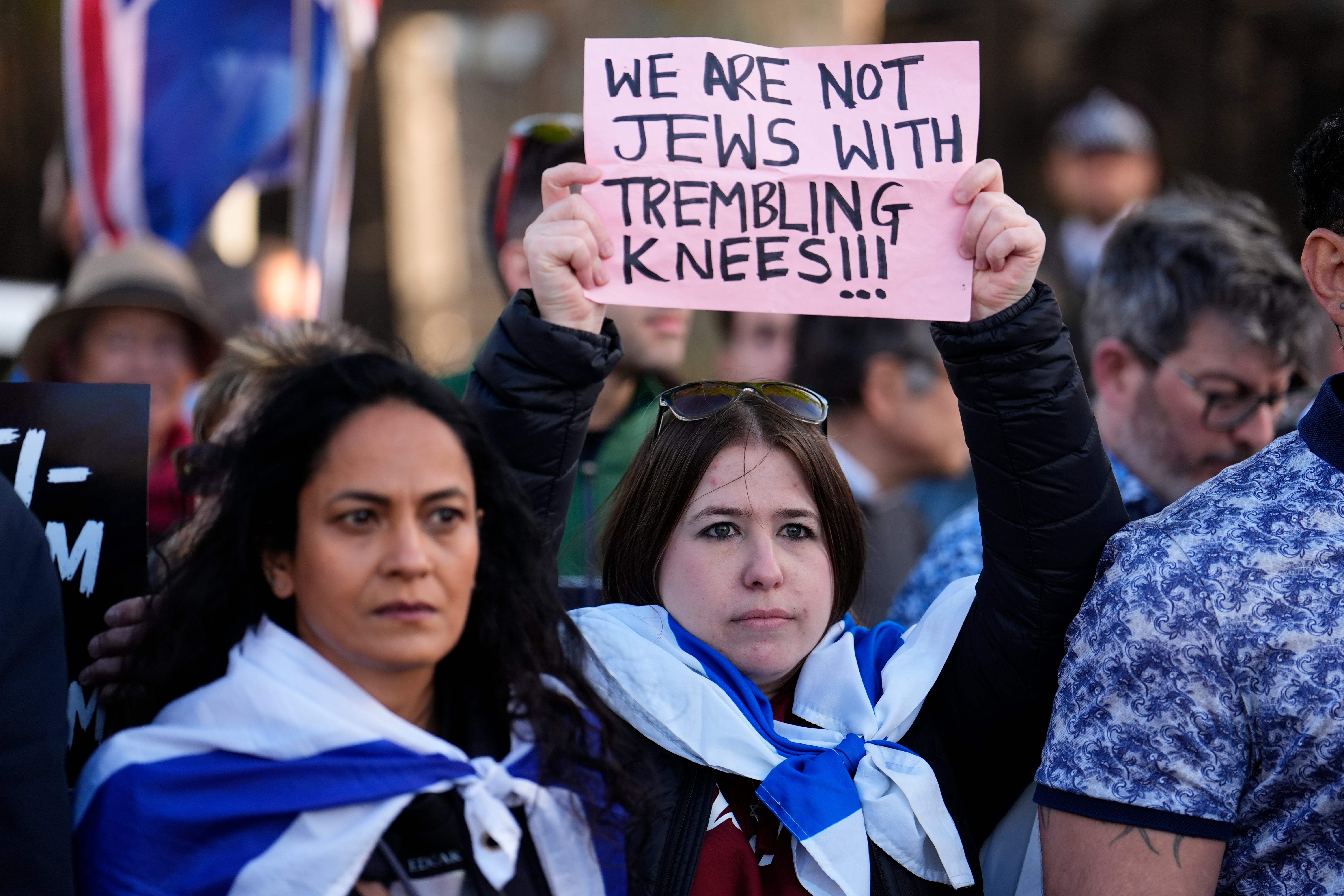 People protest near the scene in Golders Green