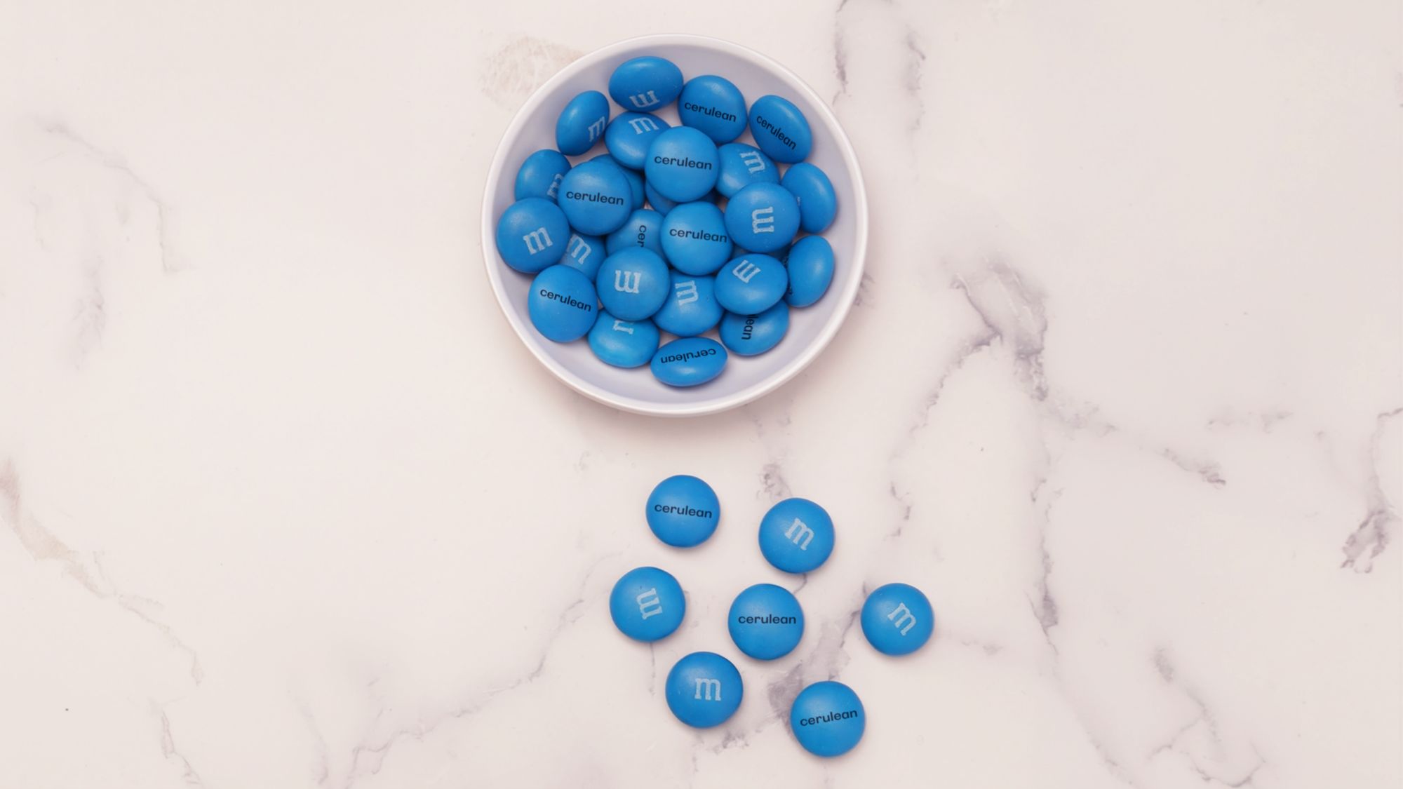 The cerulean M&M's will be available for free on a first-come, first-serve basis
