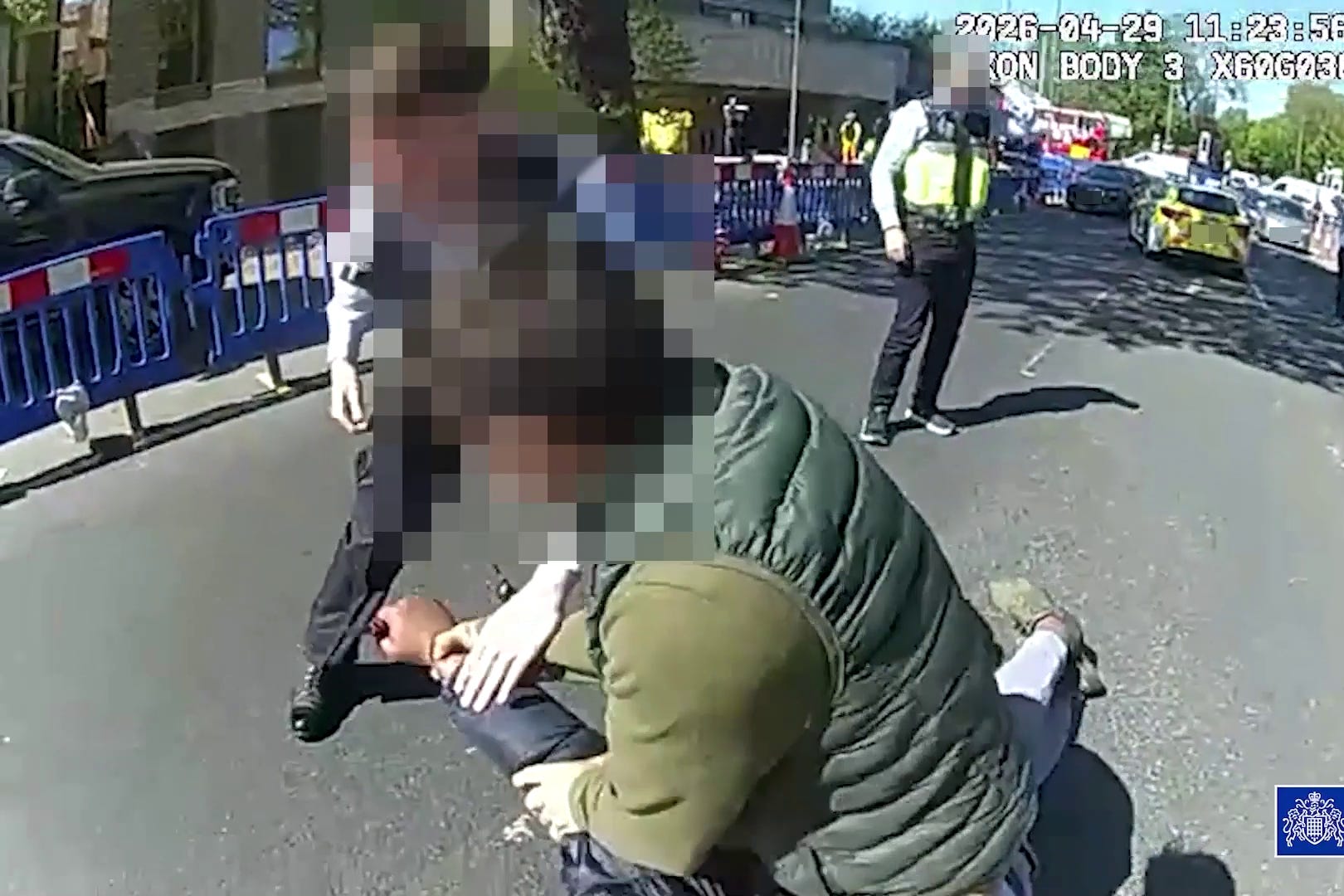 Screen grab from body worn camera of police officers confronting and arresting a 45-year-old man who remains in custody, they have said, following two people being stabbed in Golders Green (Metropolitan Police/PA)