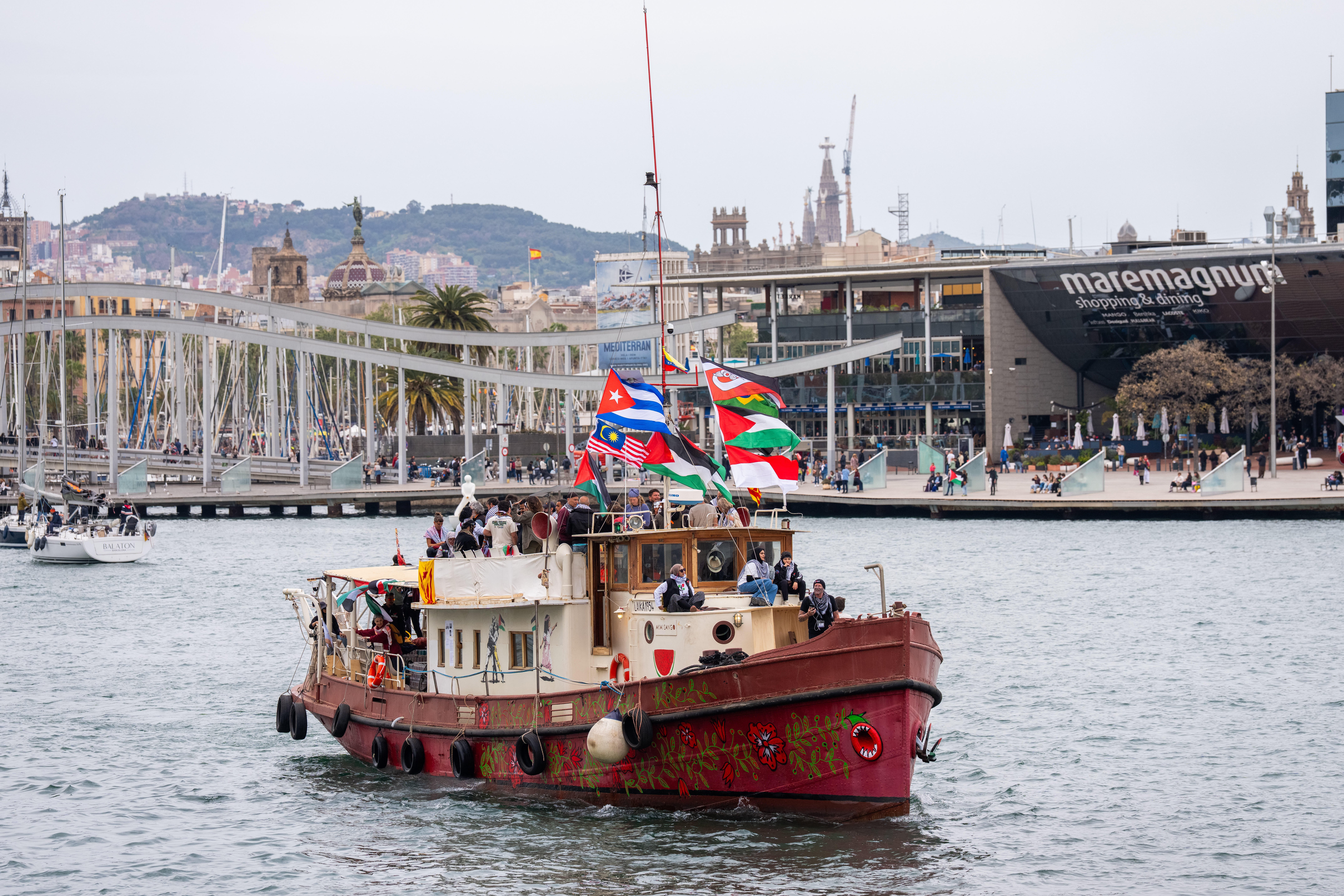 Boats carrying activists and humanitarian aid for Gaza participate in the symbolic departure of the Global Sumud Flotilla in Barcelona on 12 April