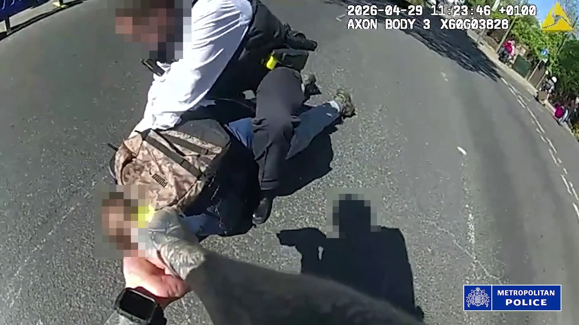 Screenshot from a body-worn camera released by the Metropolitan Police showing officers confronting and arresting a 45-year-old suspect
