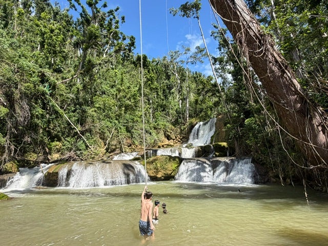 Enjoying the rope swing at the beautiful YS Falls, which re-opened three months after the hurricane